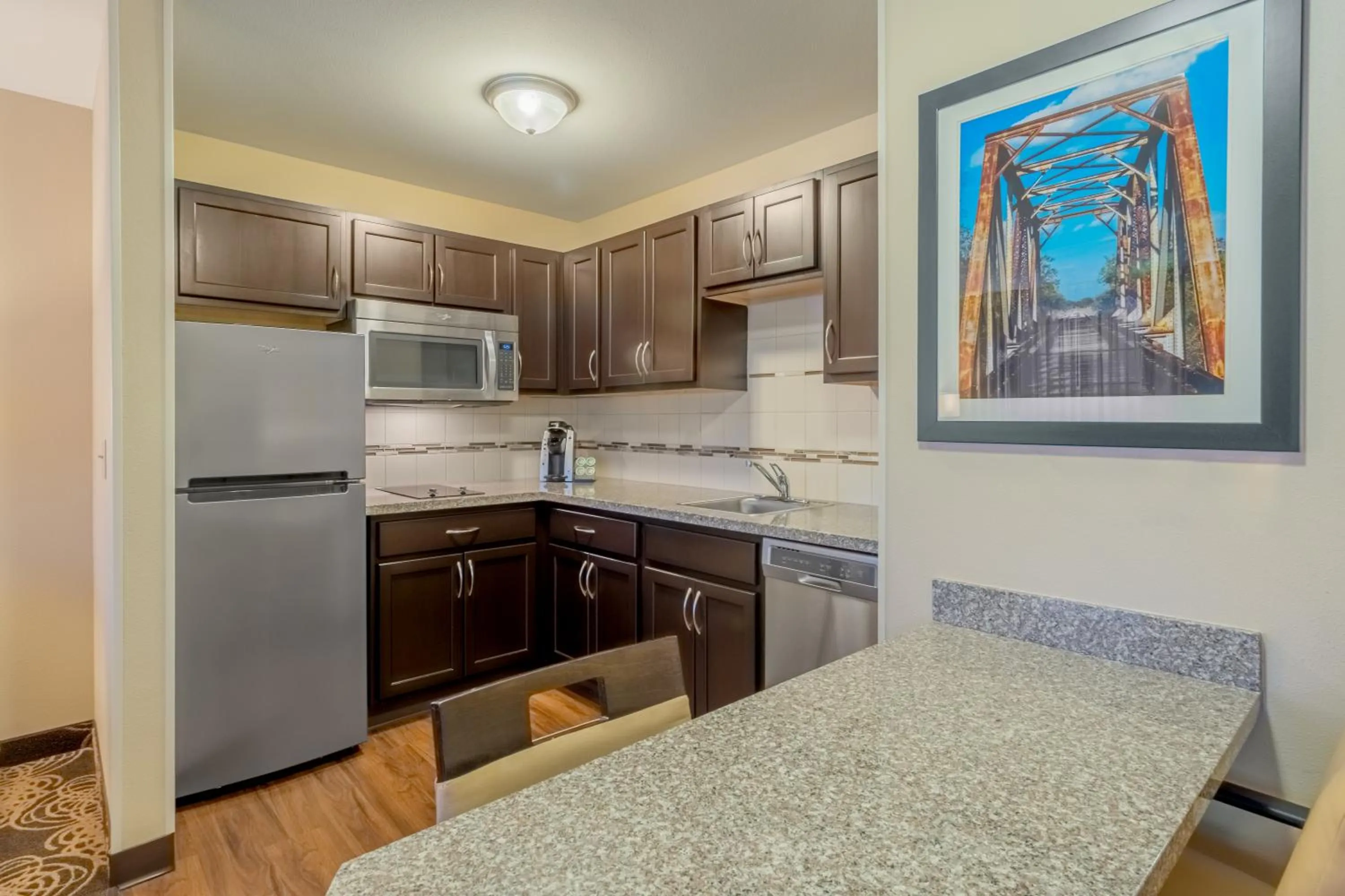 Kitchen or kitchenette in Landmark Suites - Williston