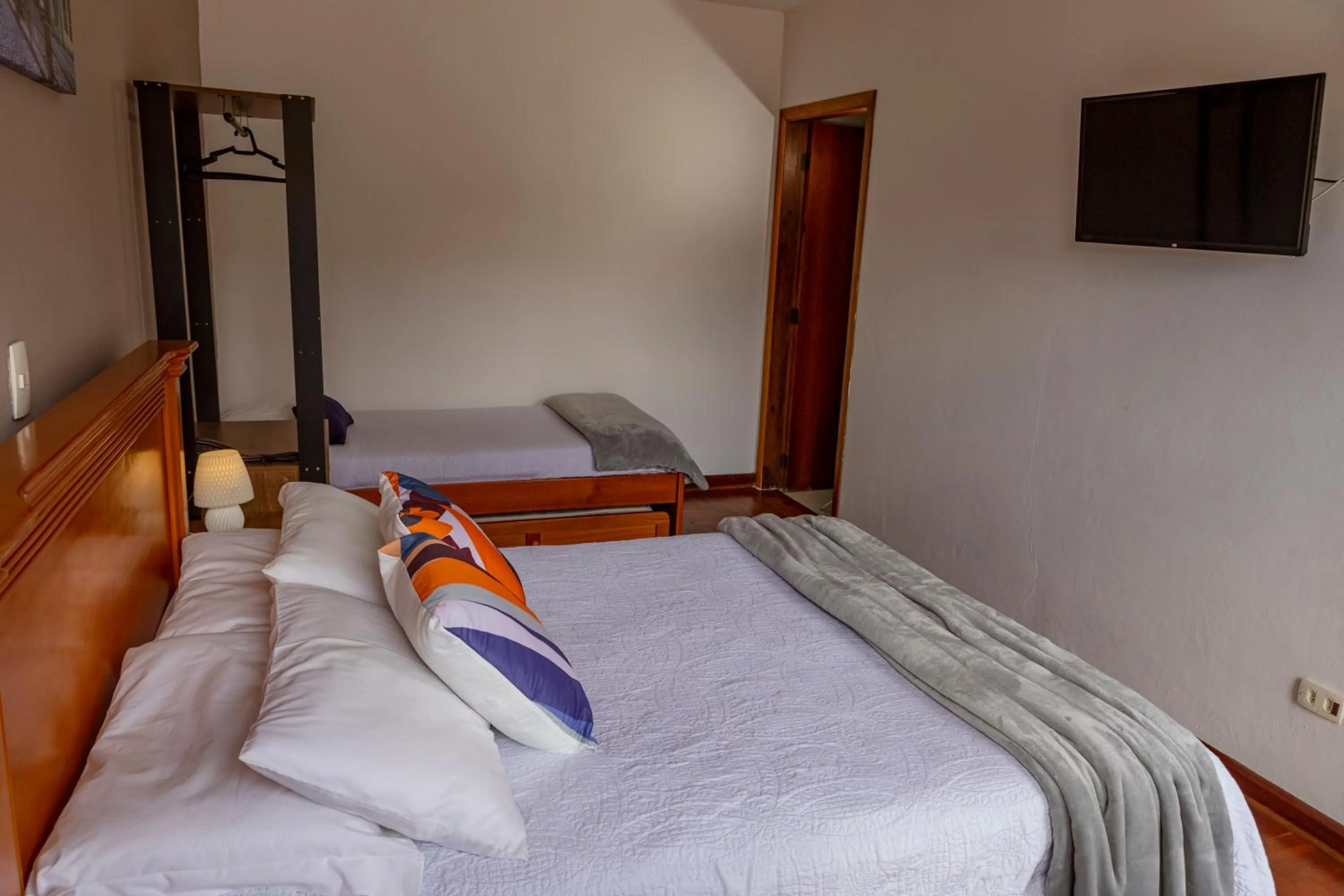 Bed in Pousada Portal da Serra