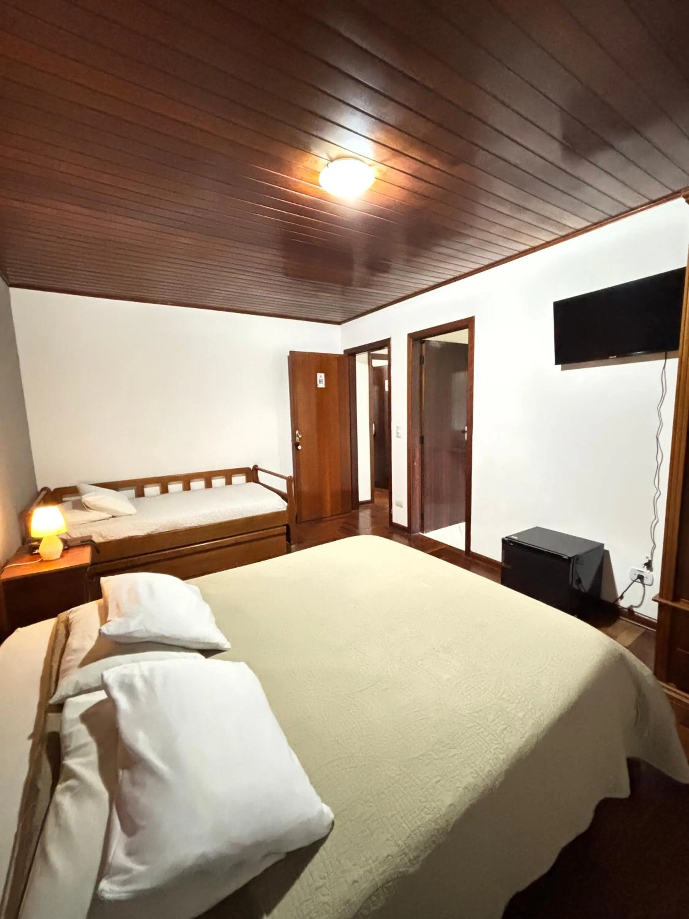 Bed in Pousada Portal da Serra