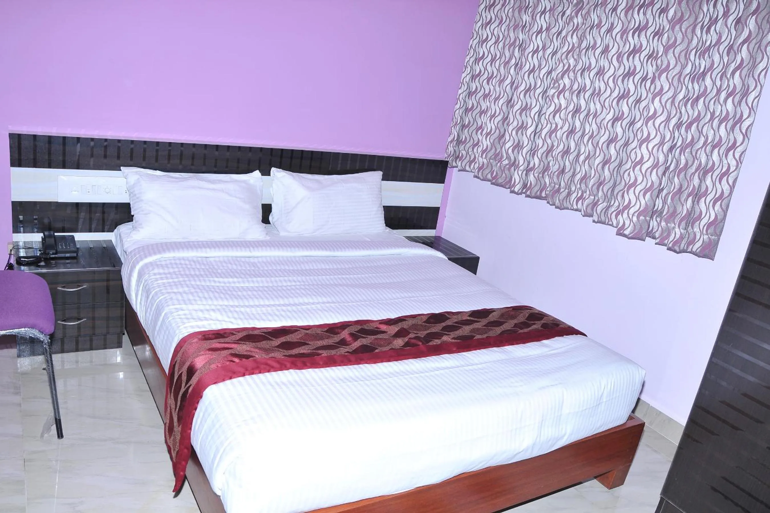 Bed in Brahma Inn