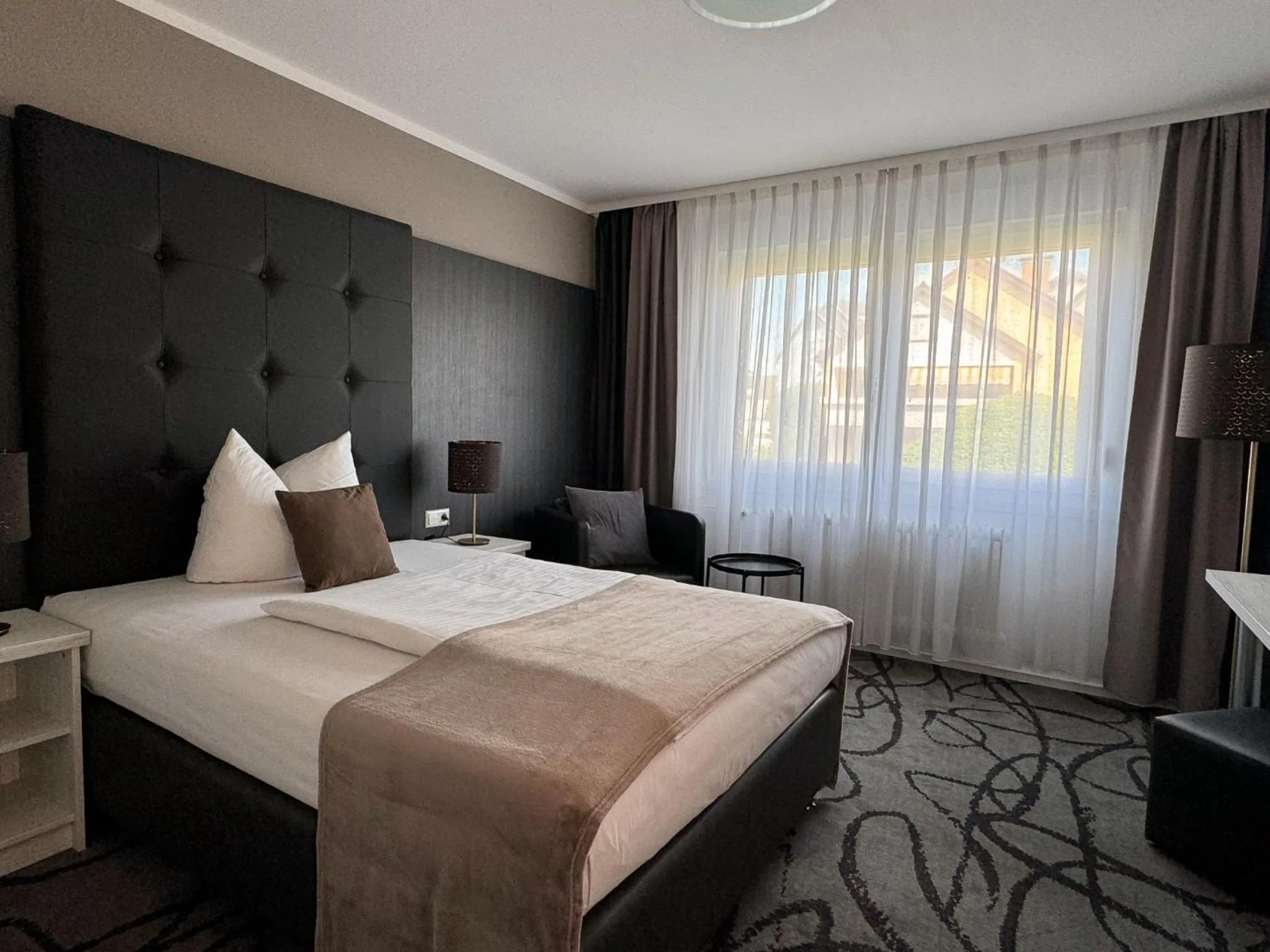 Photo of the whole room, Bed in Eisberg Hotel Schwanen