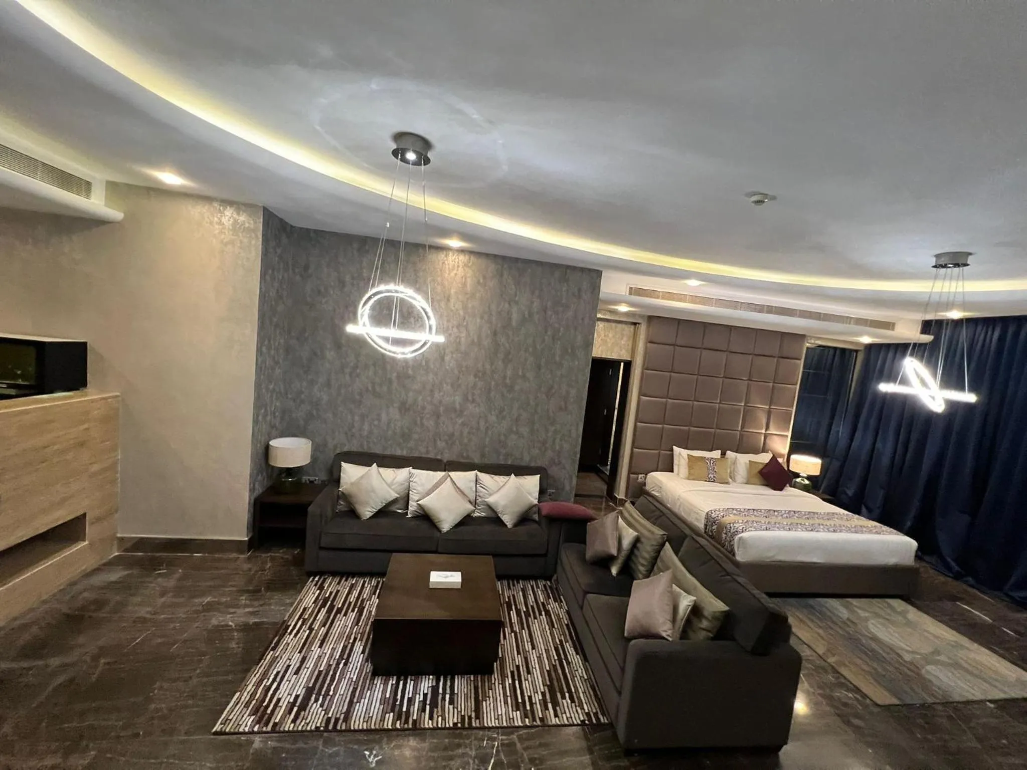 Living room, Bed in Blaire Executive Suites