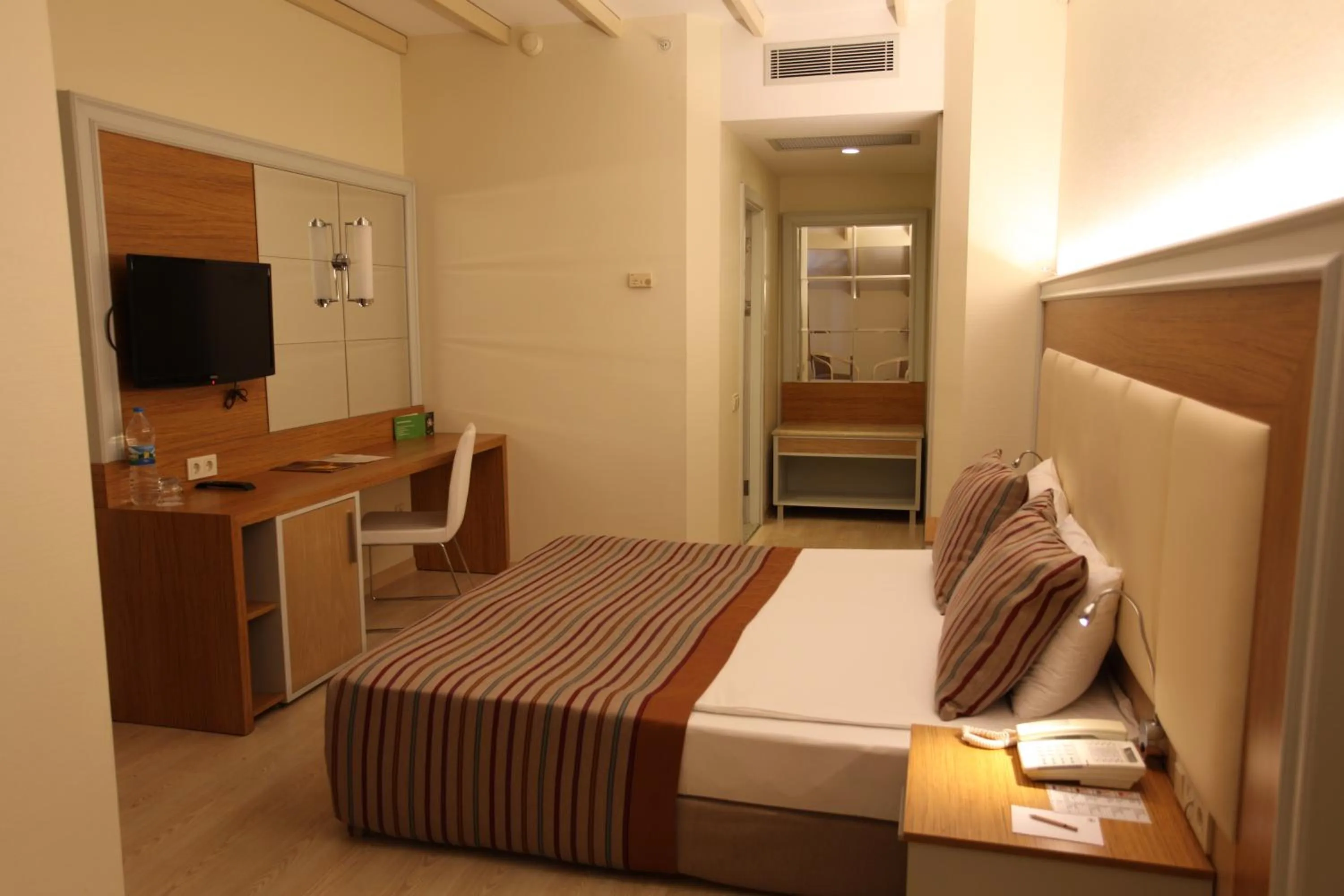 Bed in AQI Pegasos Resort