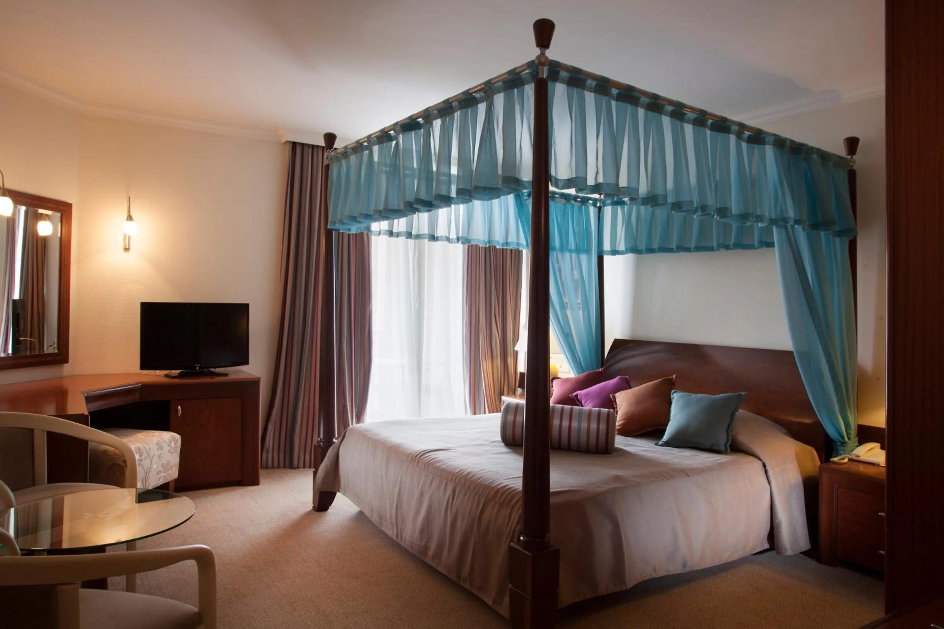 Bed in AQI Pegasos Resort