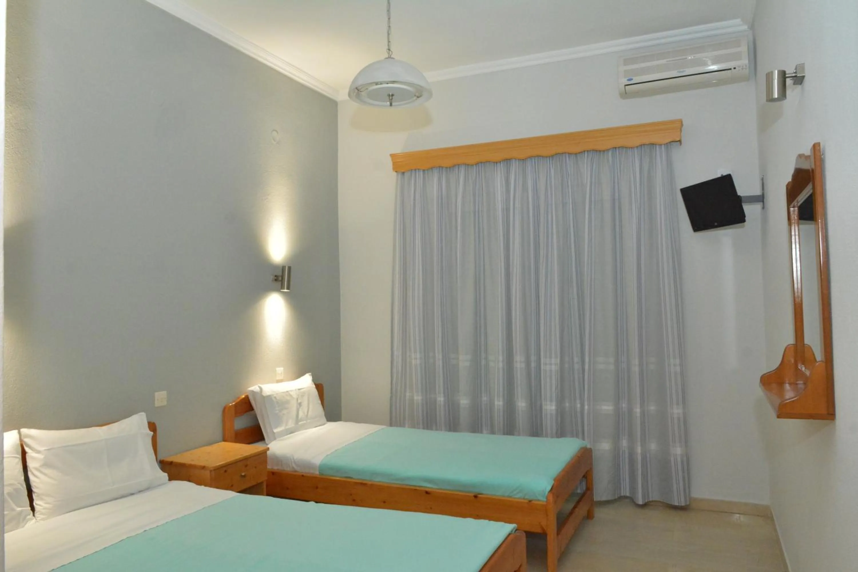 Bed in Hotel Filoxenia