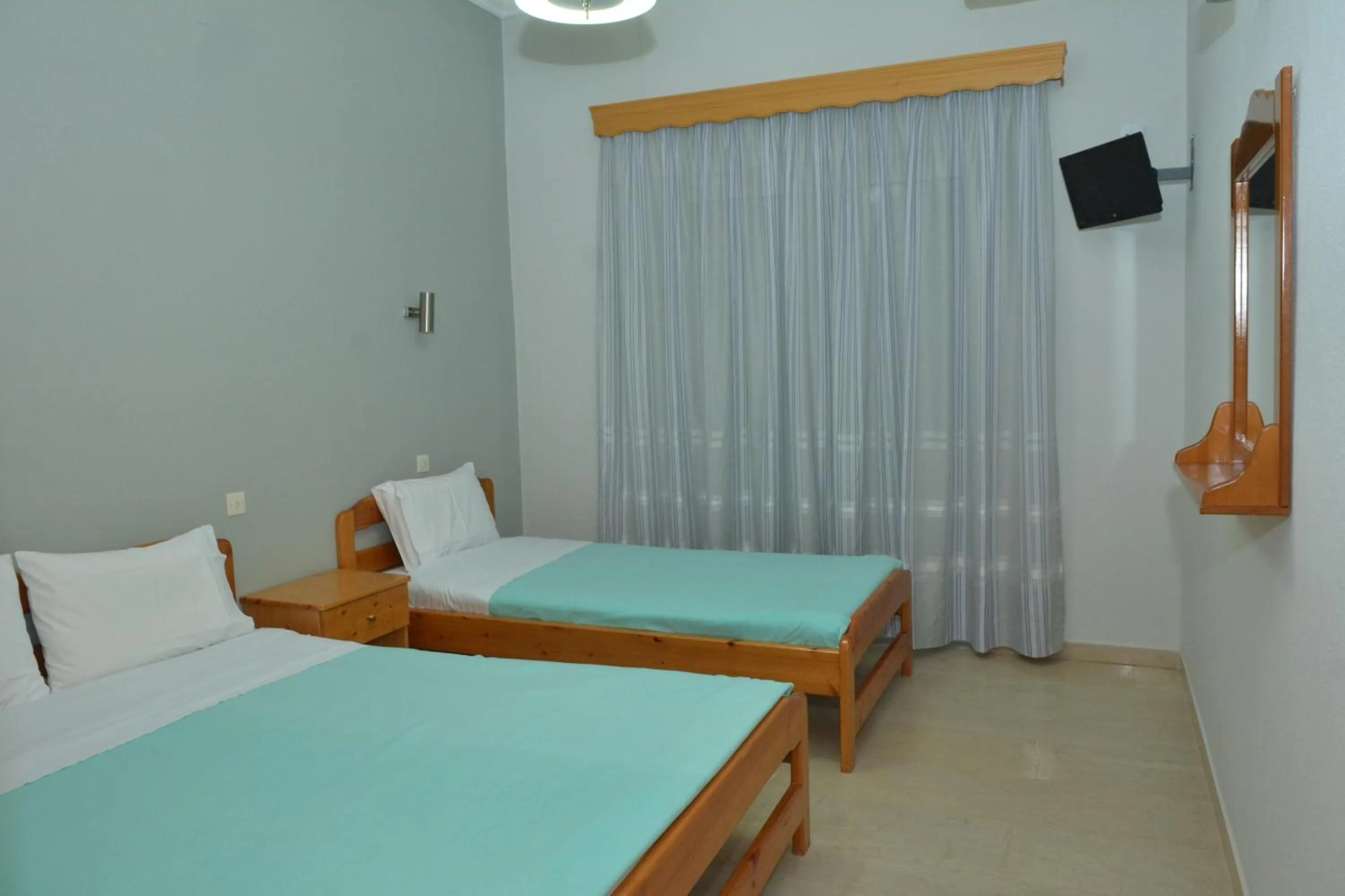 Bed in Hotel Filoxenia