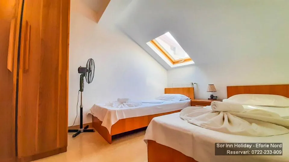 Bed in Sor Inn Holiday