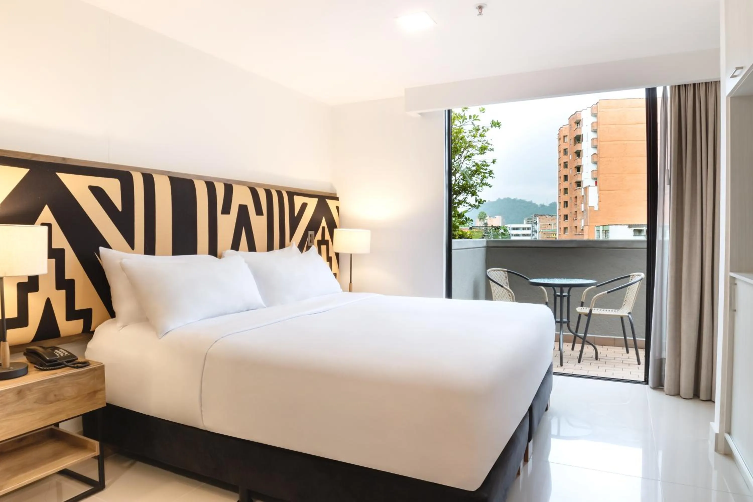 Bed in Origen Local Suites