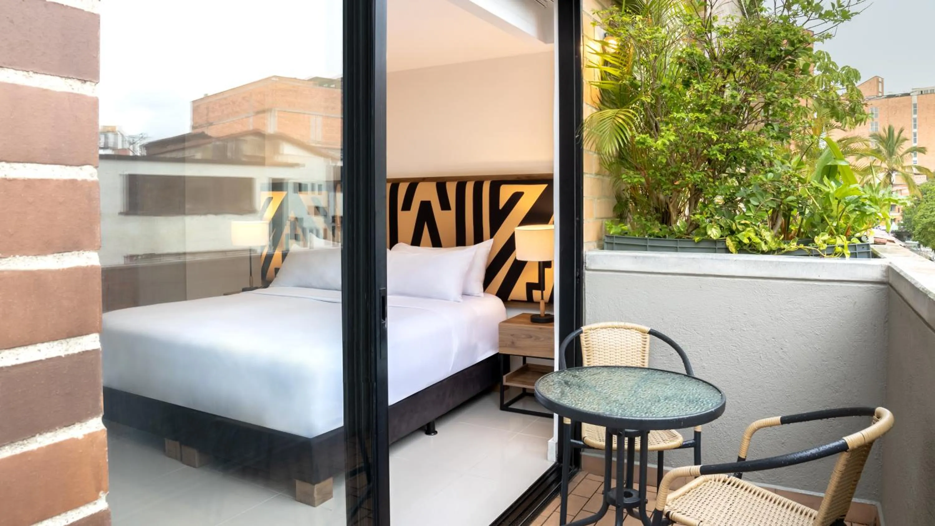 Bed in Origen Local Suites