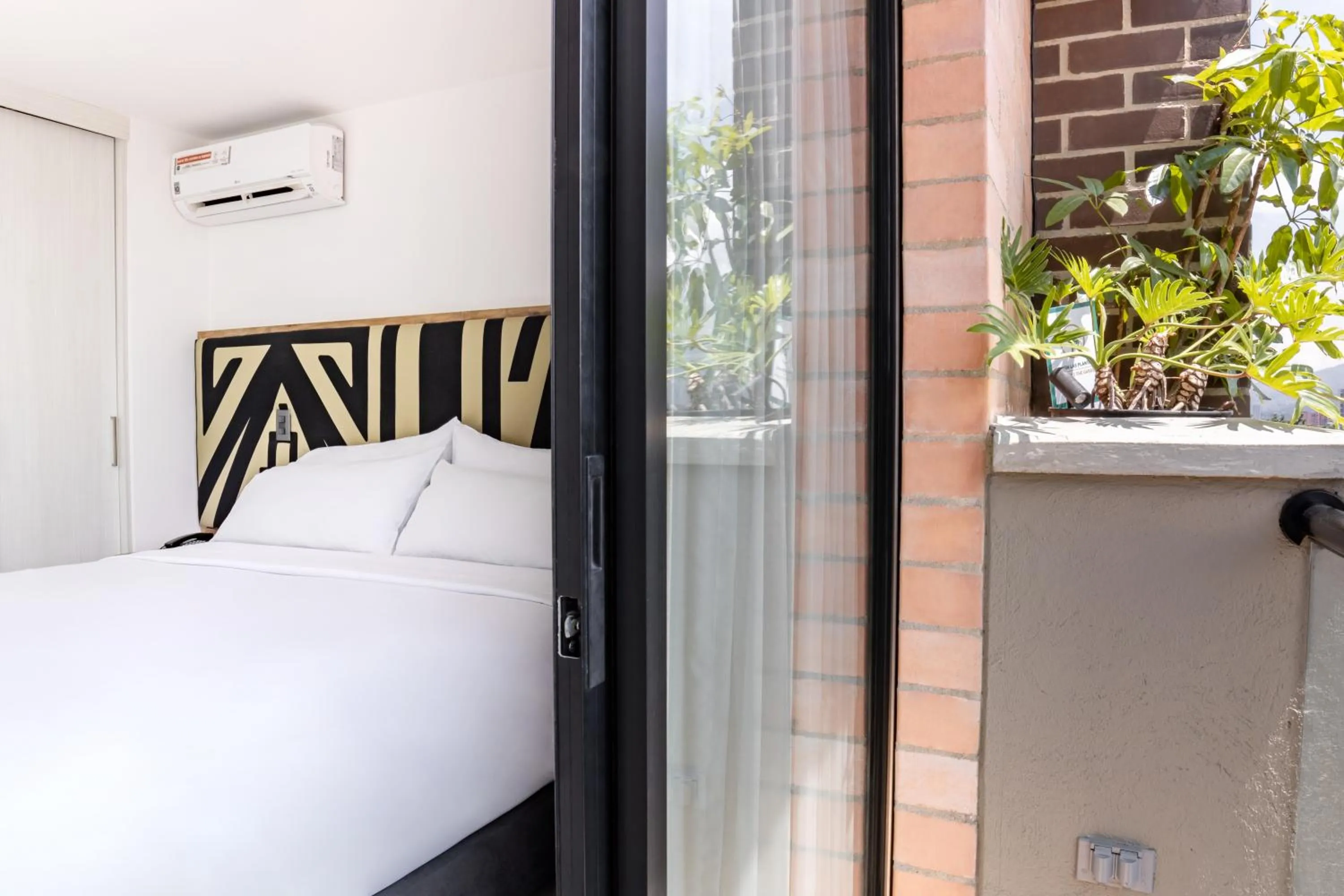 Bed in Origen Local Suites