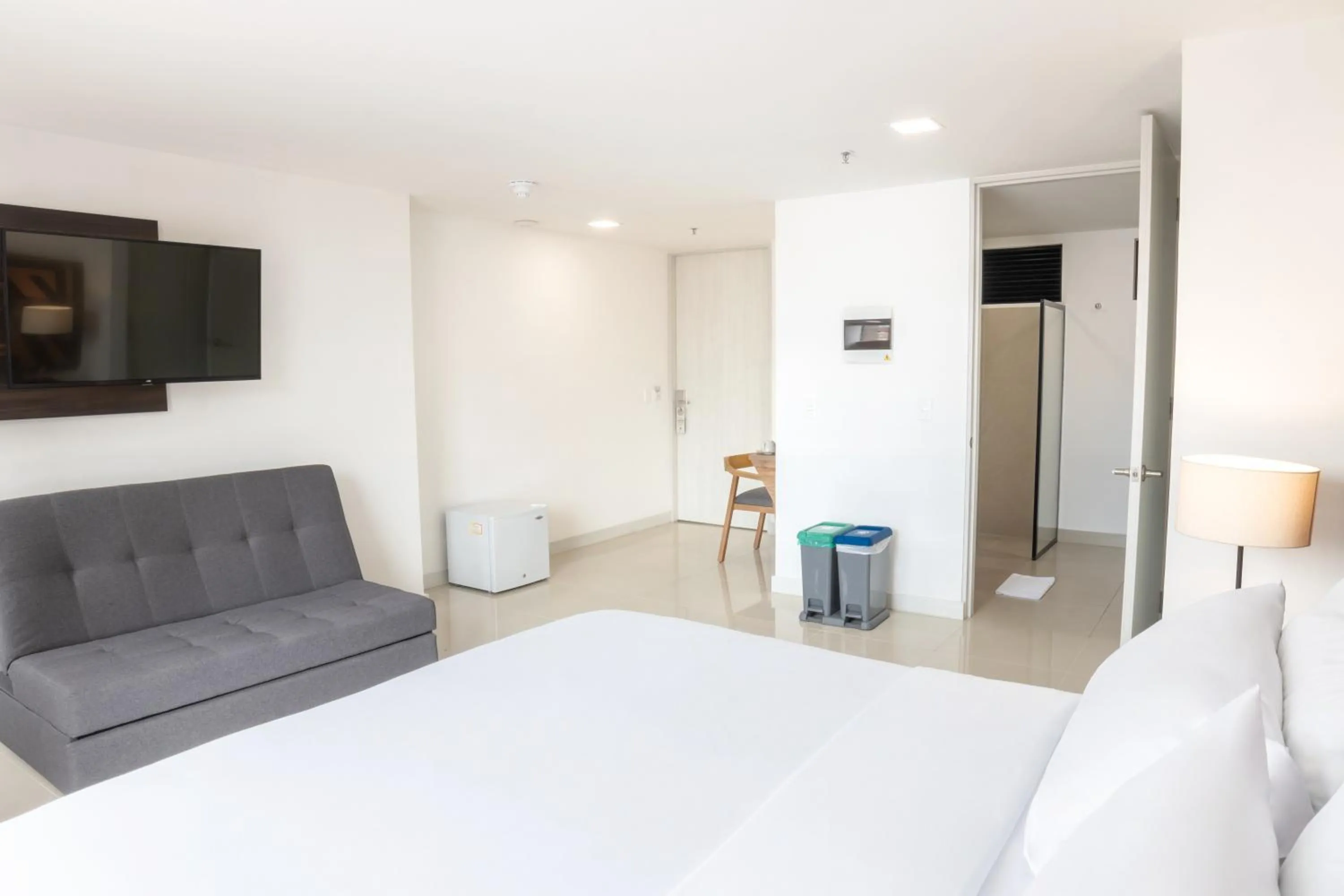 Bed in Origen Local Suites