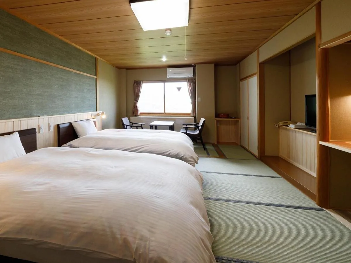 Bed in Hotel Iwasuge