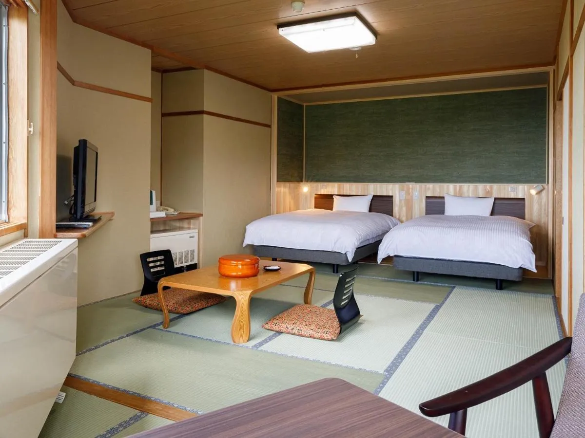 Bed in Hotel Iwasuge