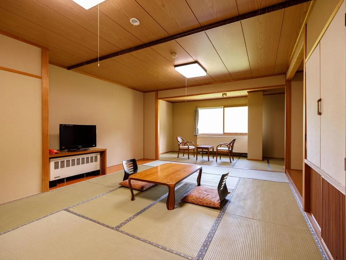 Bed in Hotel Iwasuge