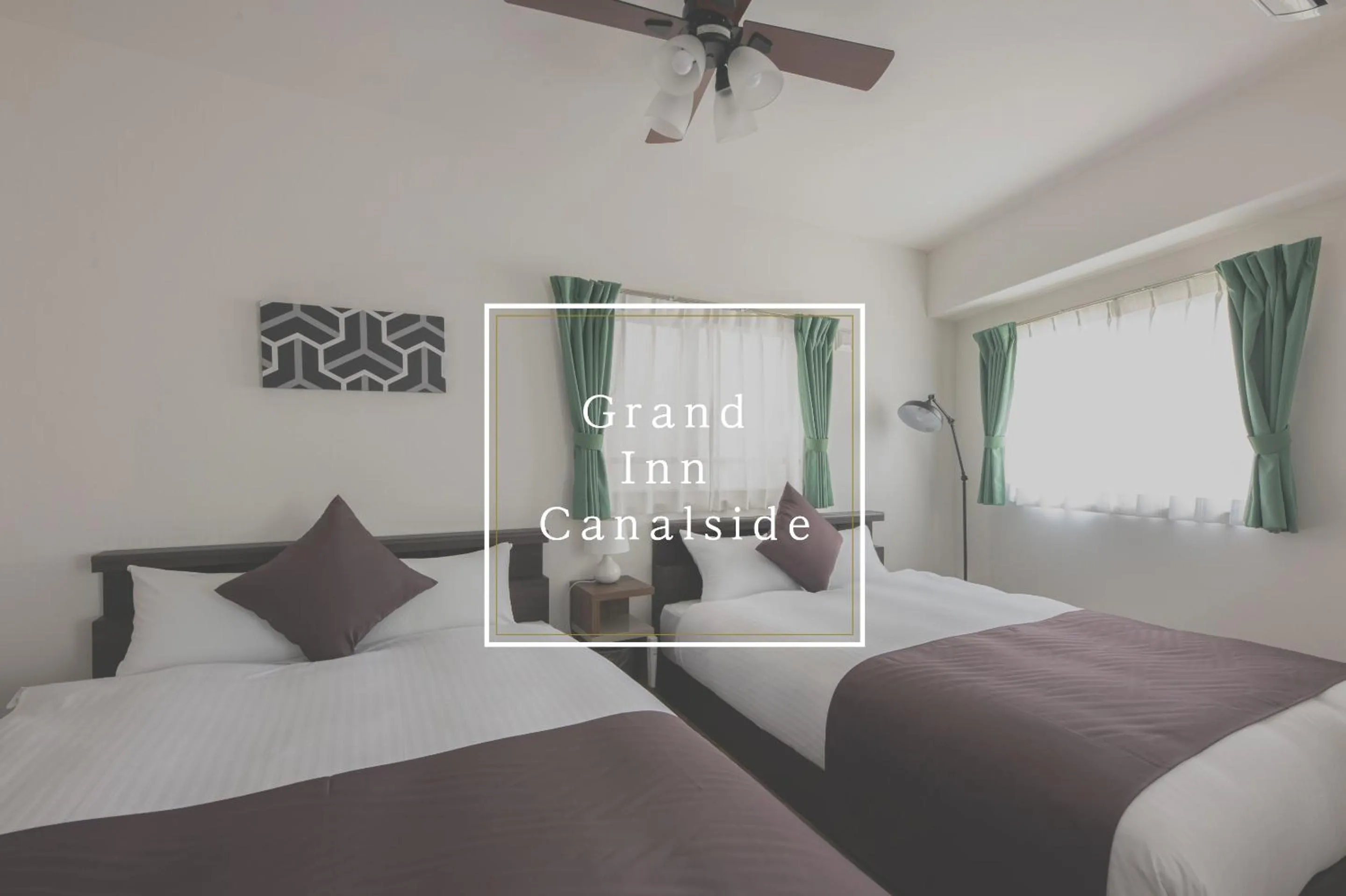 Text overlay, Bed in Grand Inn Canalside