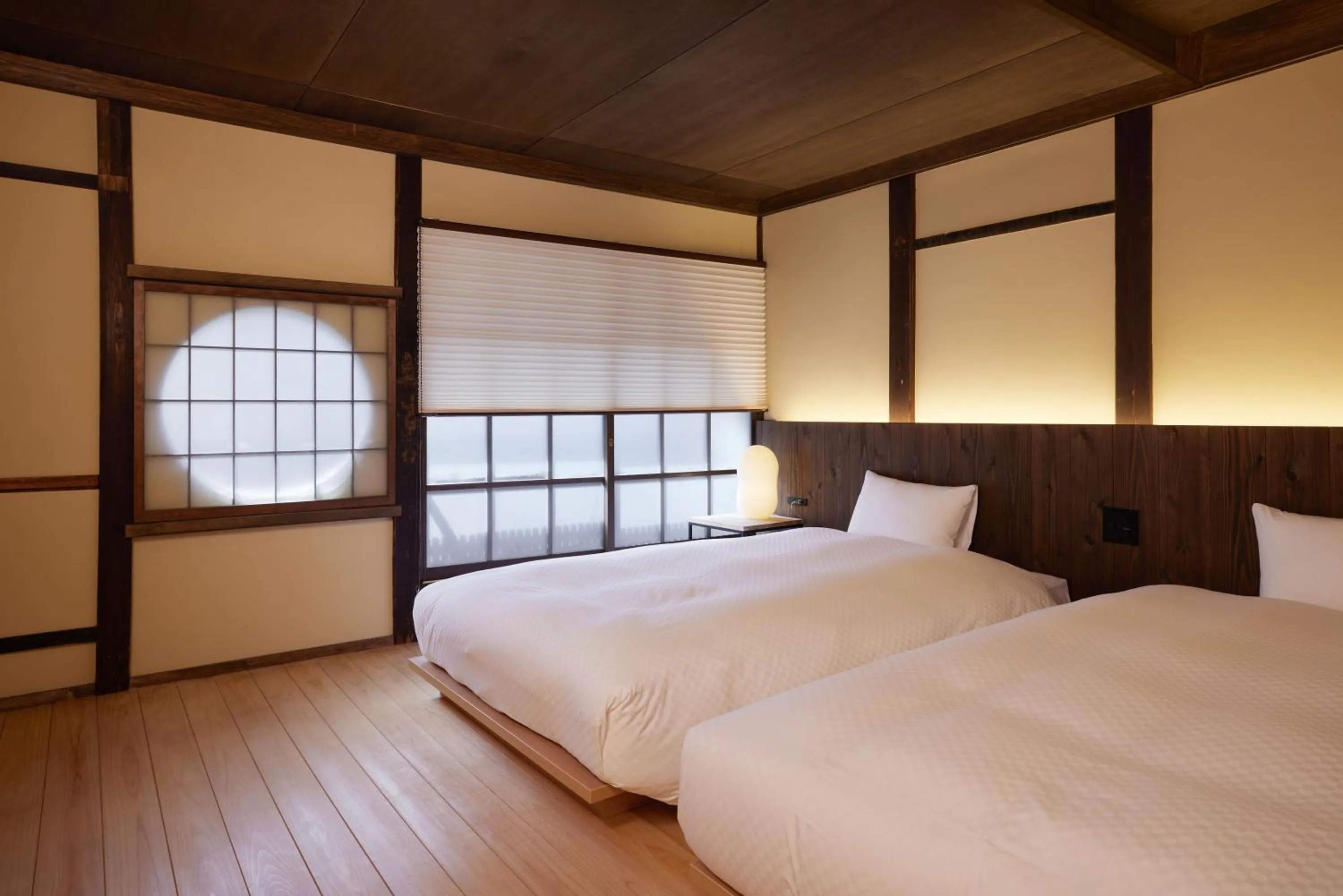 Bed in NIPPONIA HOTEL Ozu Castle Town