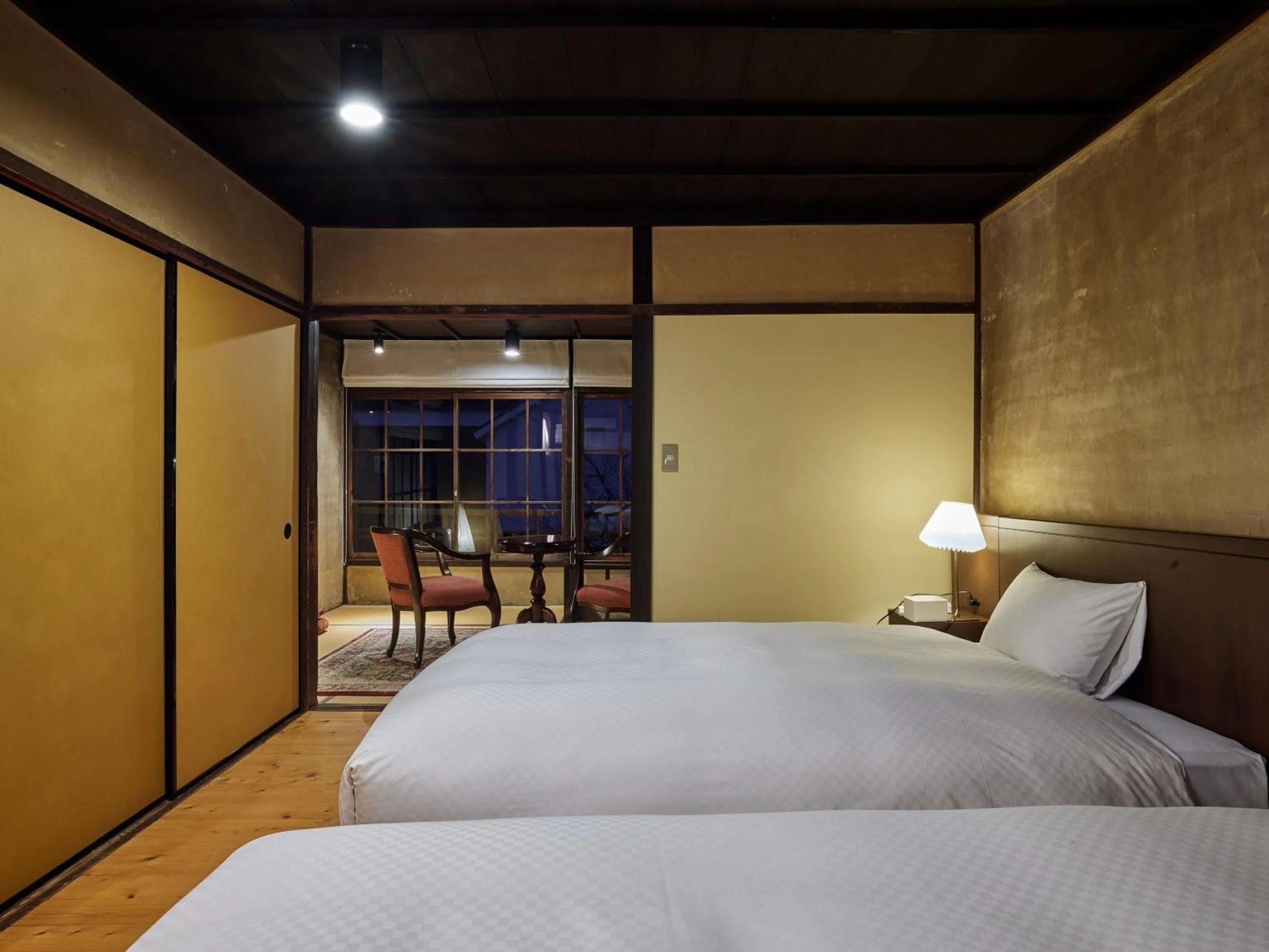 Bed in NIPPONIA HOTEL Ozu Castle Town