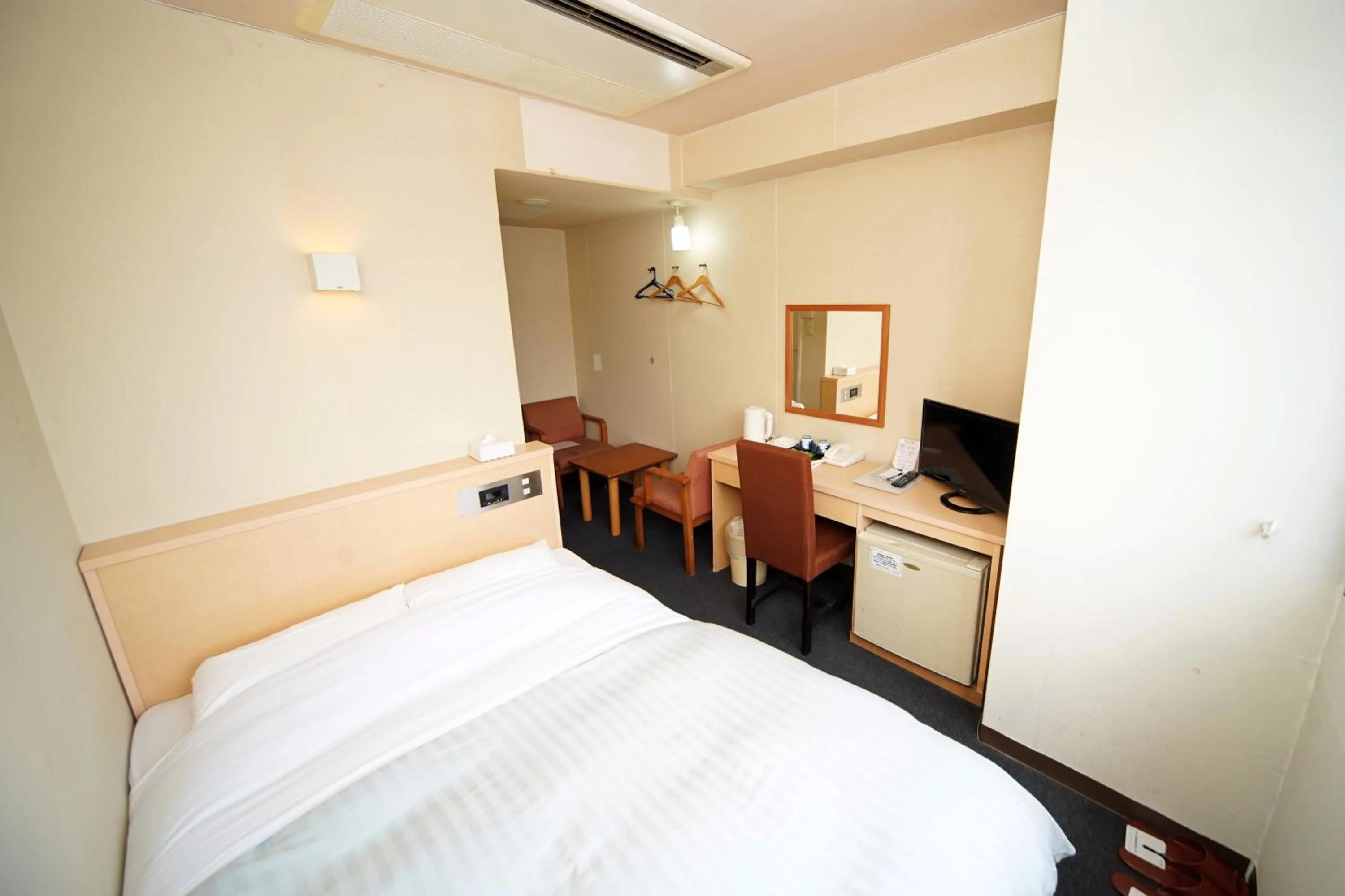 Bed in Amami Port Tower Hotel