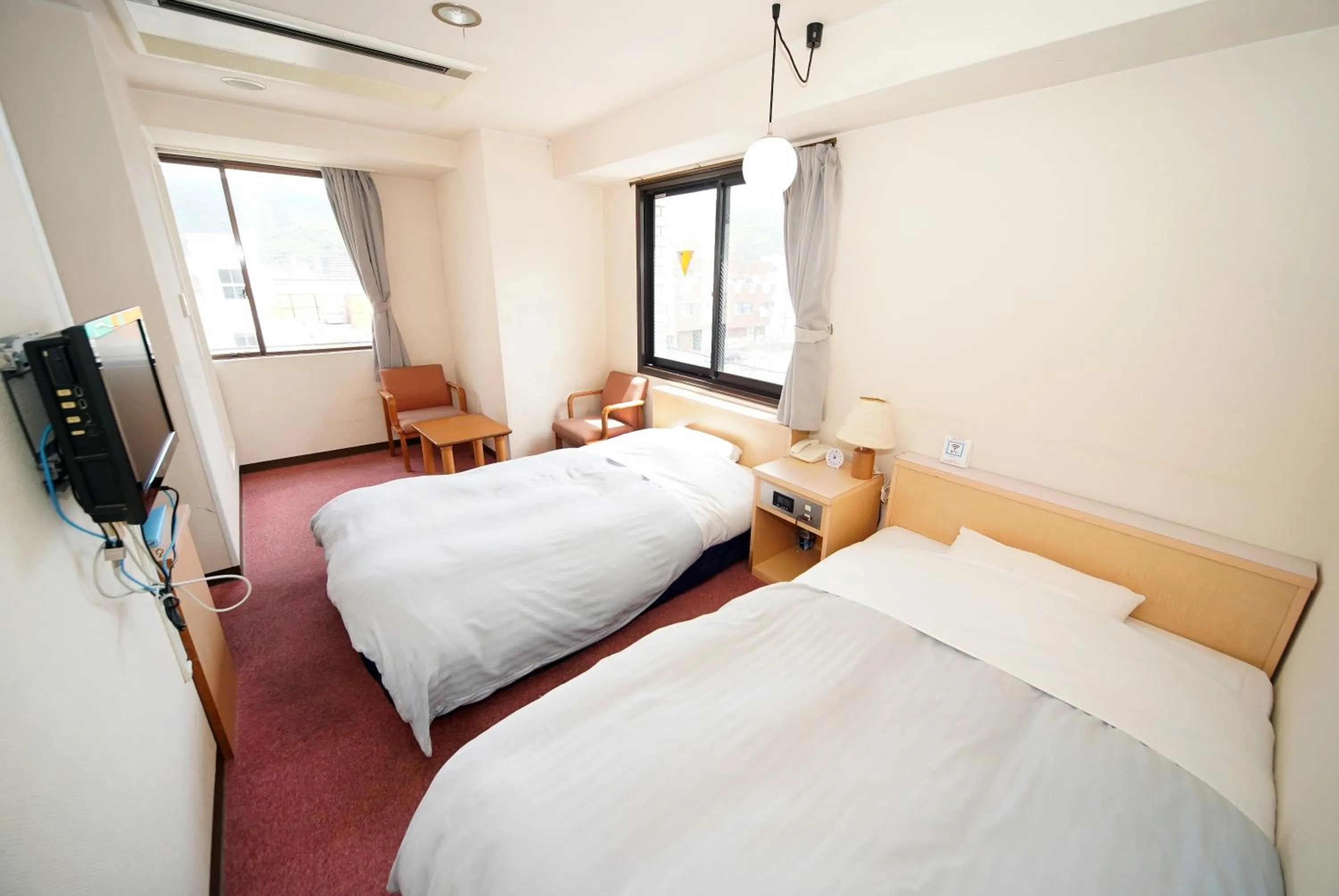 Bed in Amami Port Tower Hotel