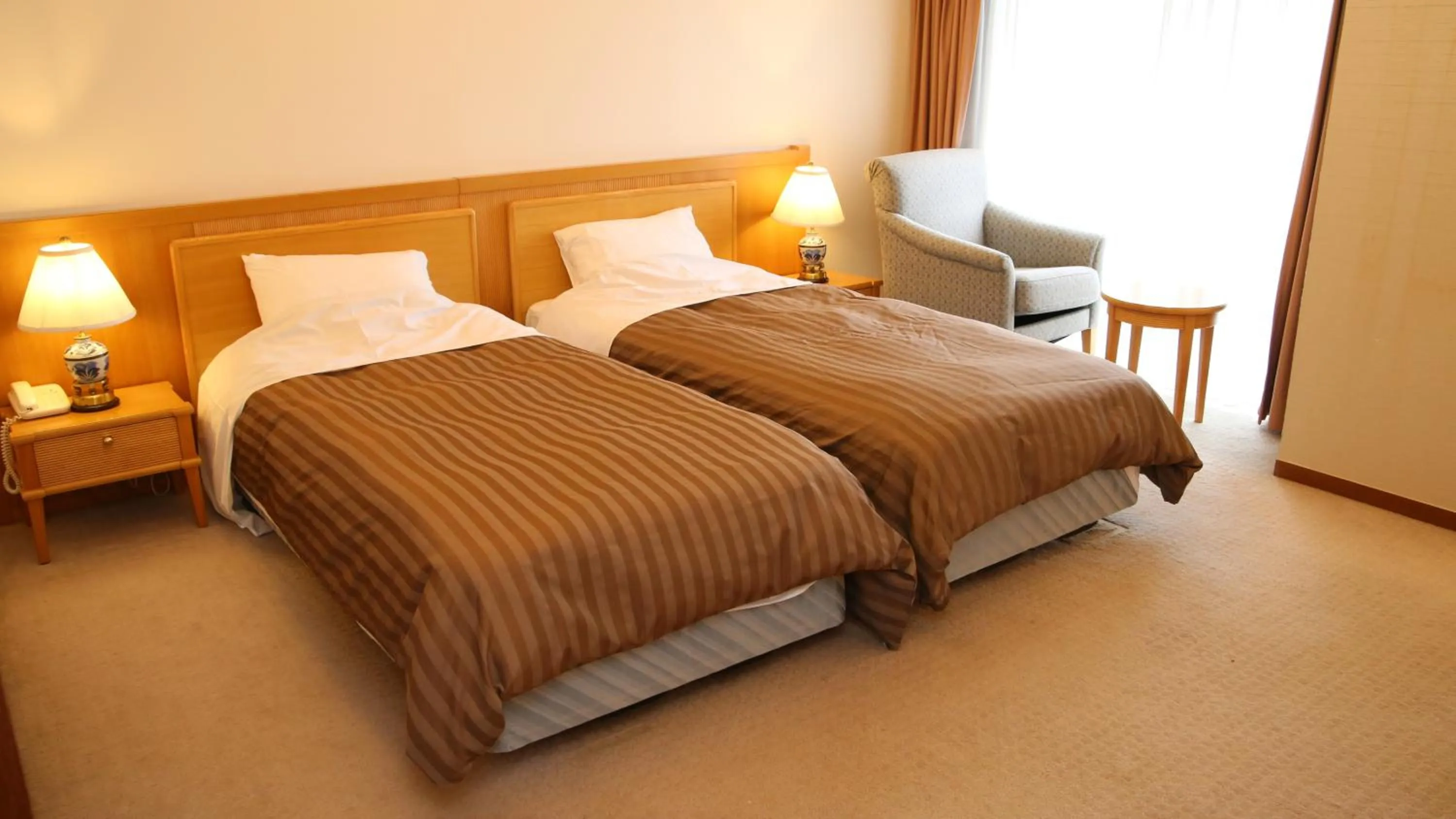 Bed in Nishiizu Crystal View Hotel