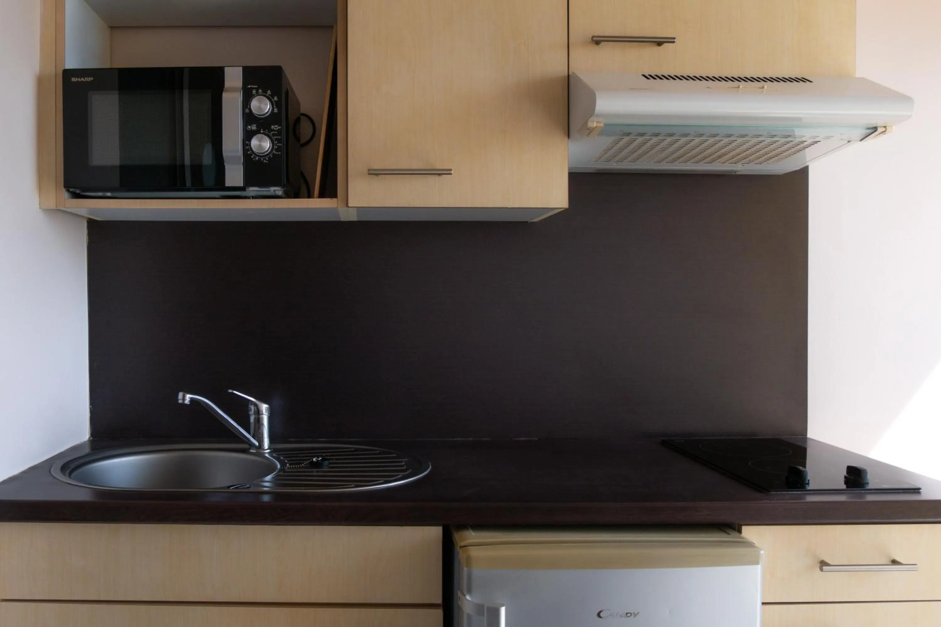 Kitchen or kitchenette in Hôtel Iloma