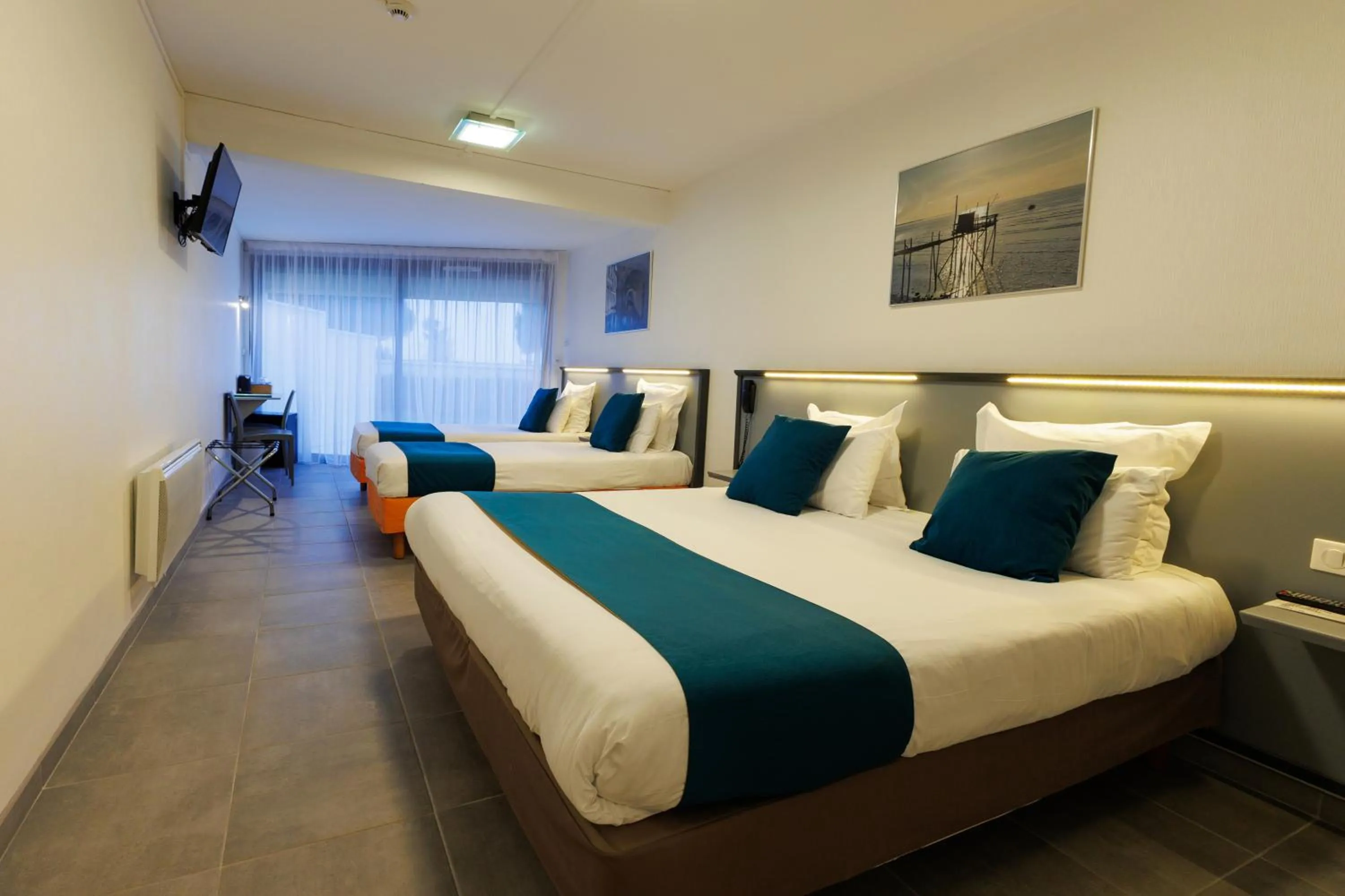 Photo of the whole room, Bed in Logis Hôtel Le Rochelois