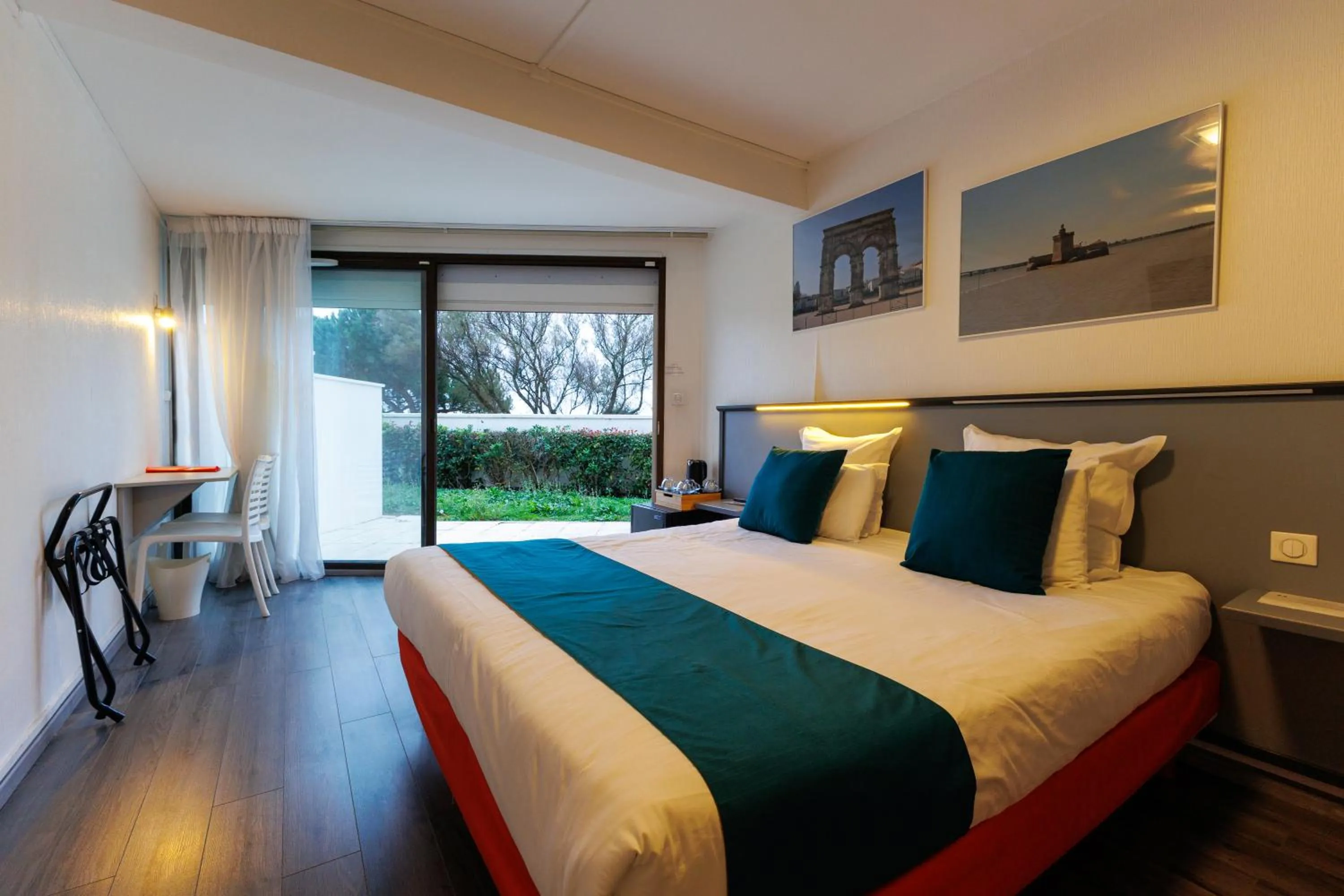 Photo of the whole room, Bed in Logis Hôtel Le Rochelois