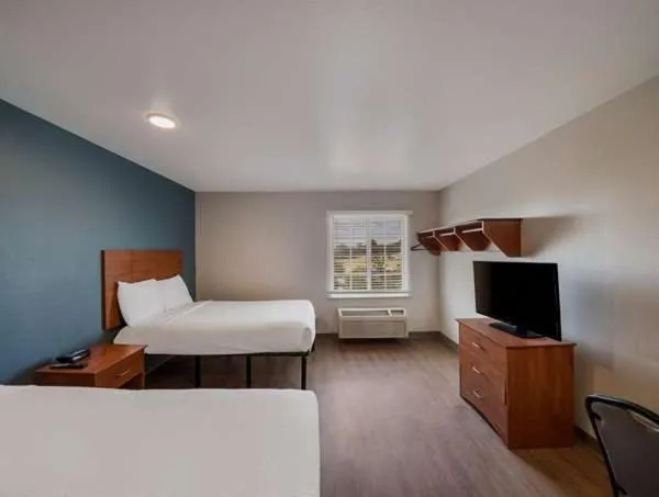 Bed in WoodSpring Suites Fort Worth Trophy Club