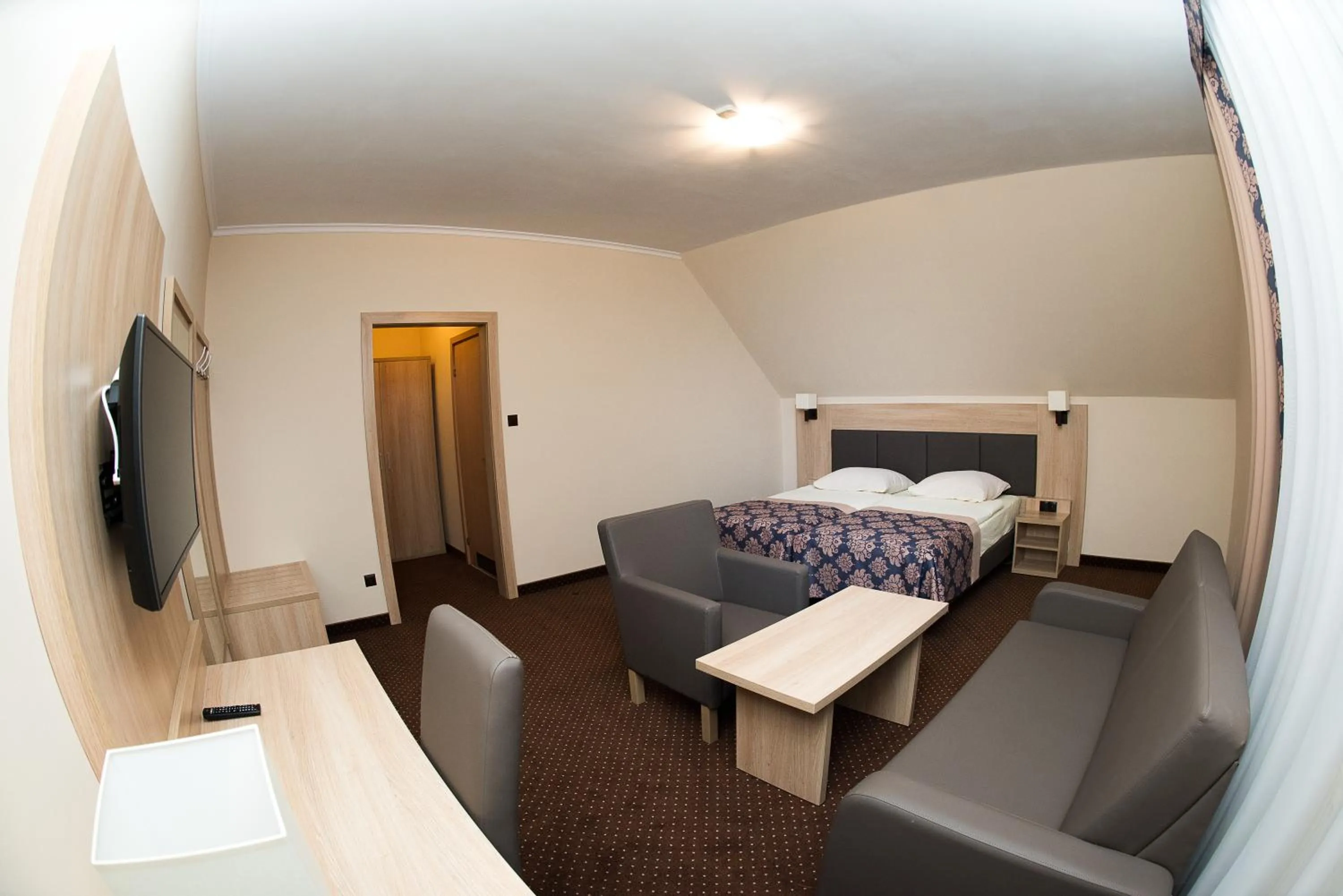 Seating area, Bed in Motel DB2000