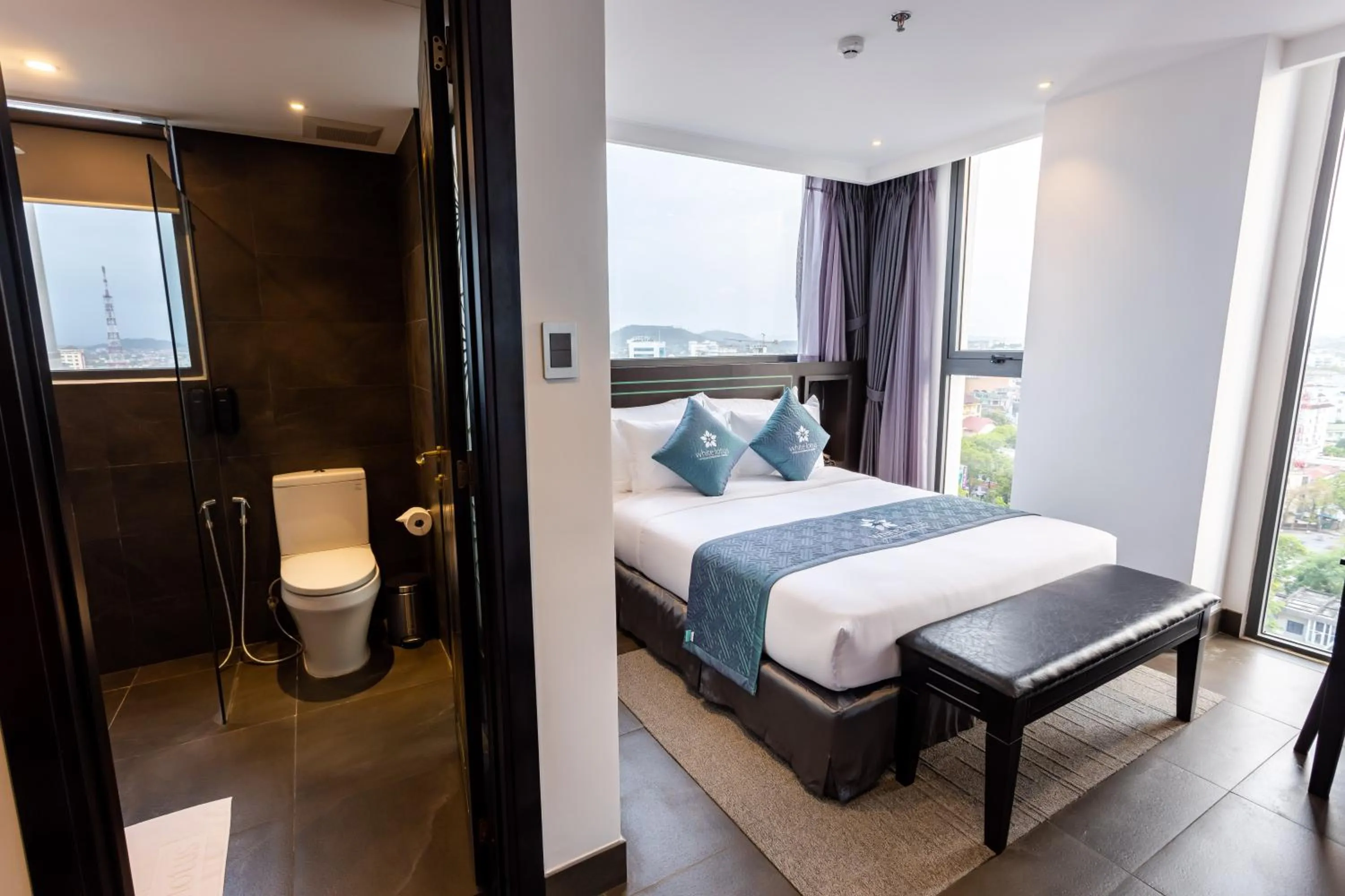 Photo of the whole room, Bed in White Lotus Hue Hotel