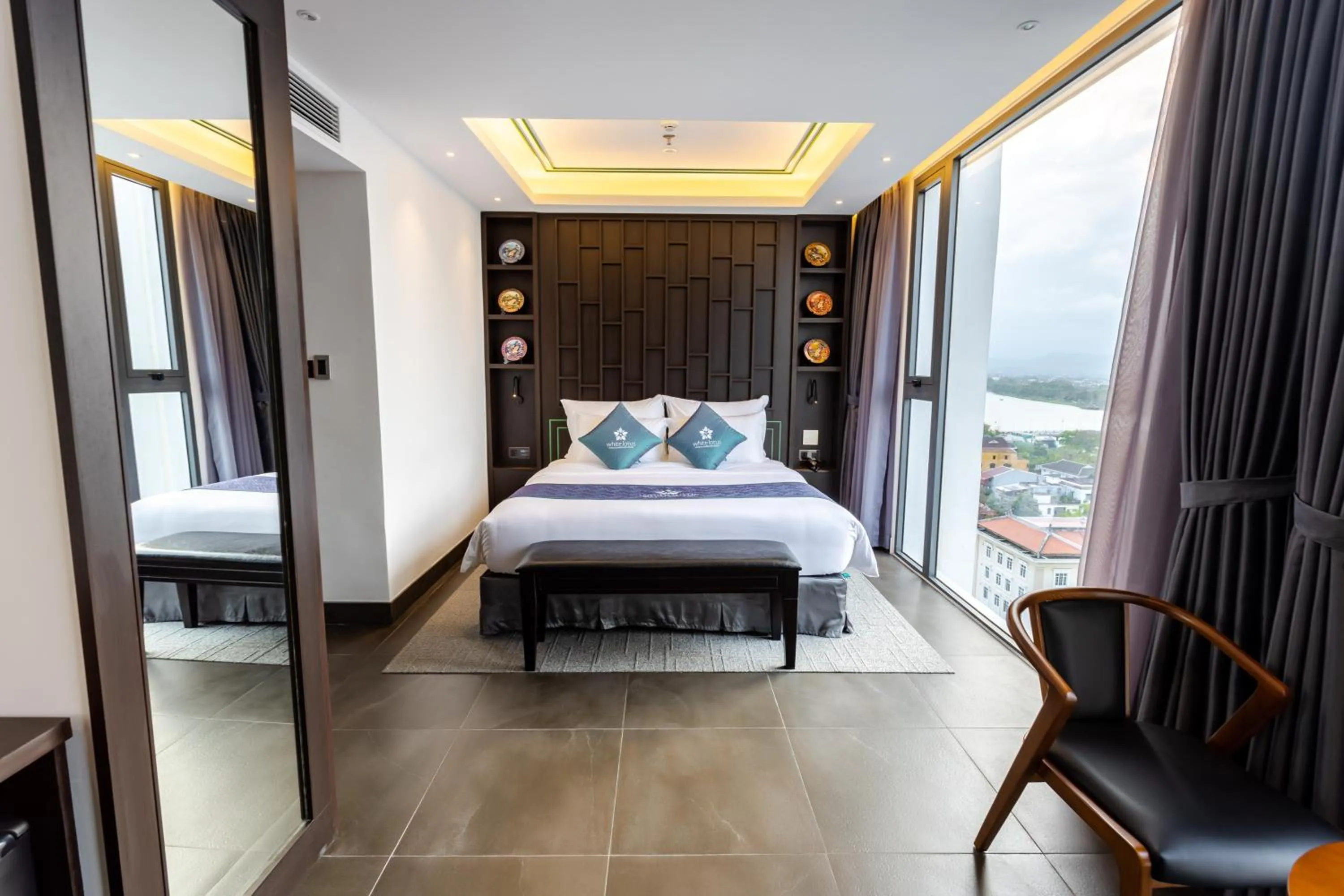 Photo of the whole room, Bed in White Lotus Hue Hotel