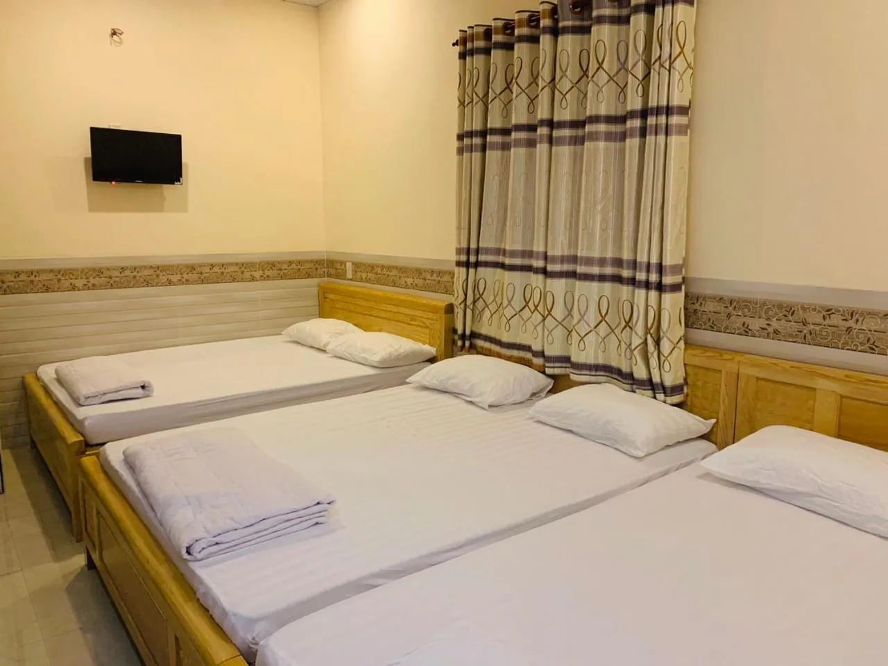 Bed in Mekong Rose Hotel