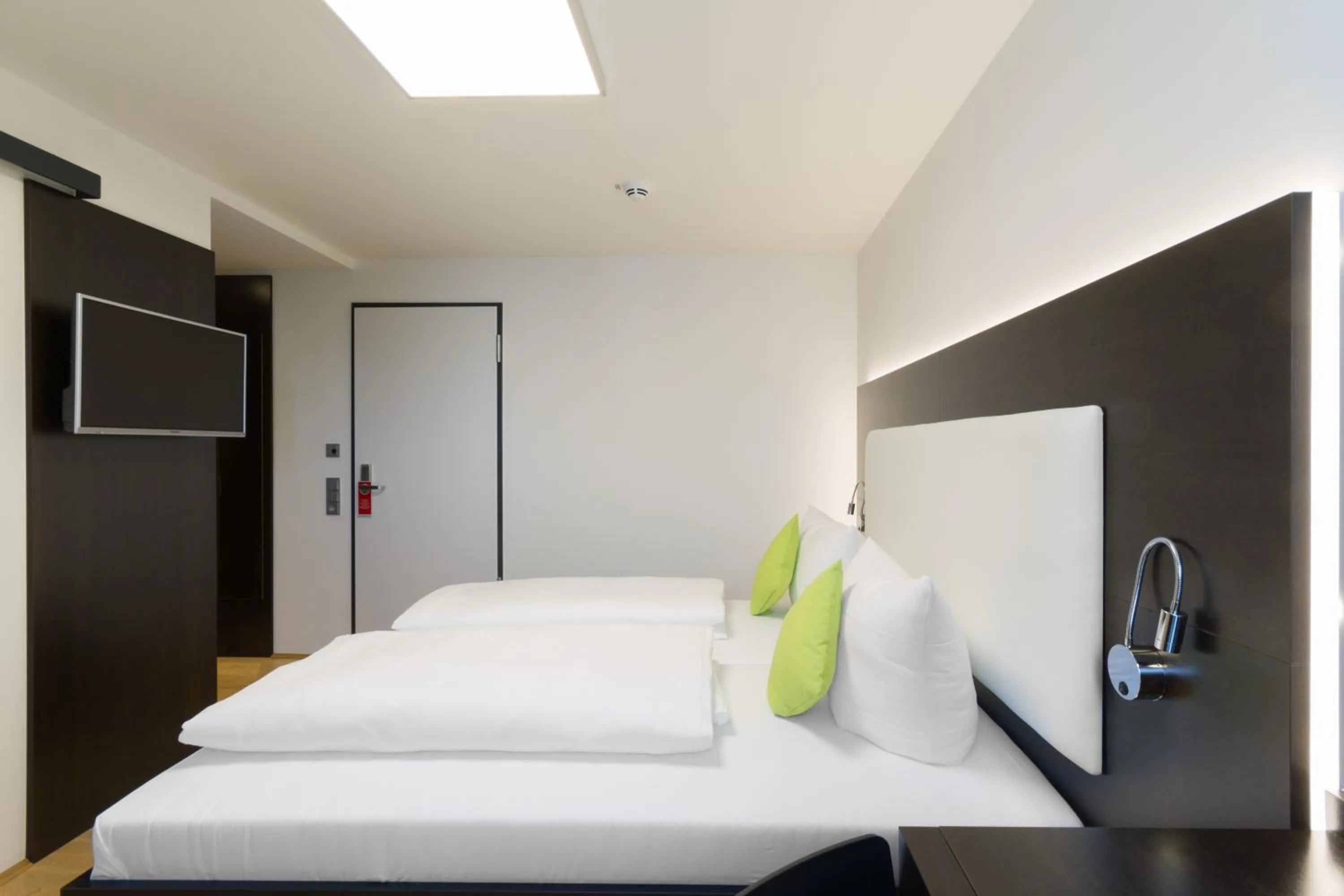 Bedroom, Bed in sevenDays Hotel BoardingHouse Mannheim