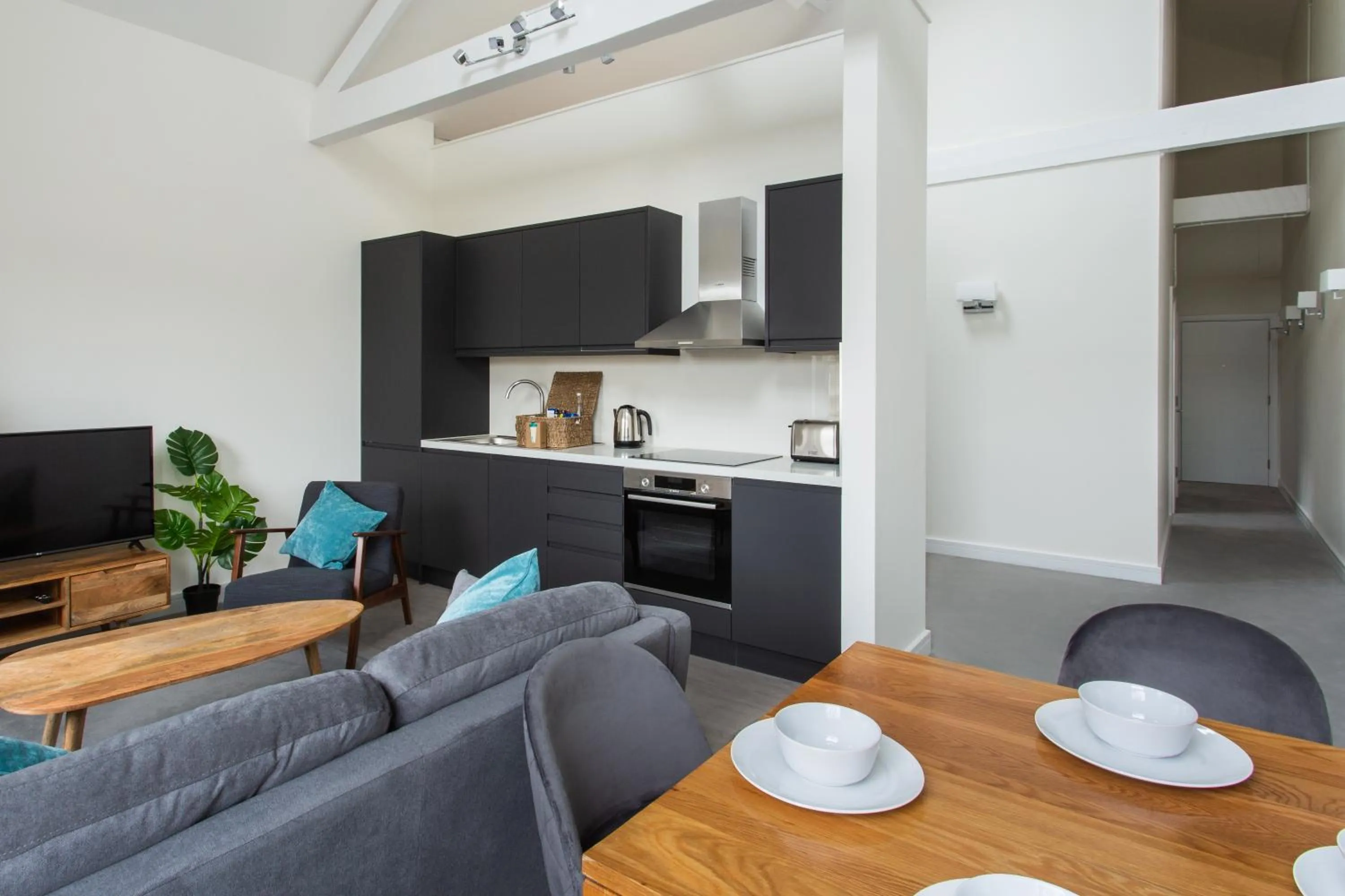 Living room in Queens Park by Viridian Apartments