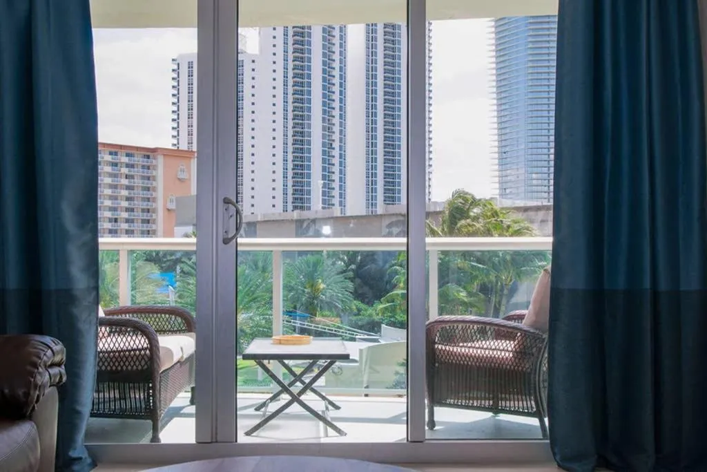 Balcony/Terrace in Beautiful Apartment Steps Away from the Beach