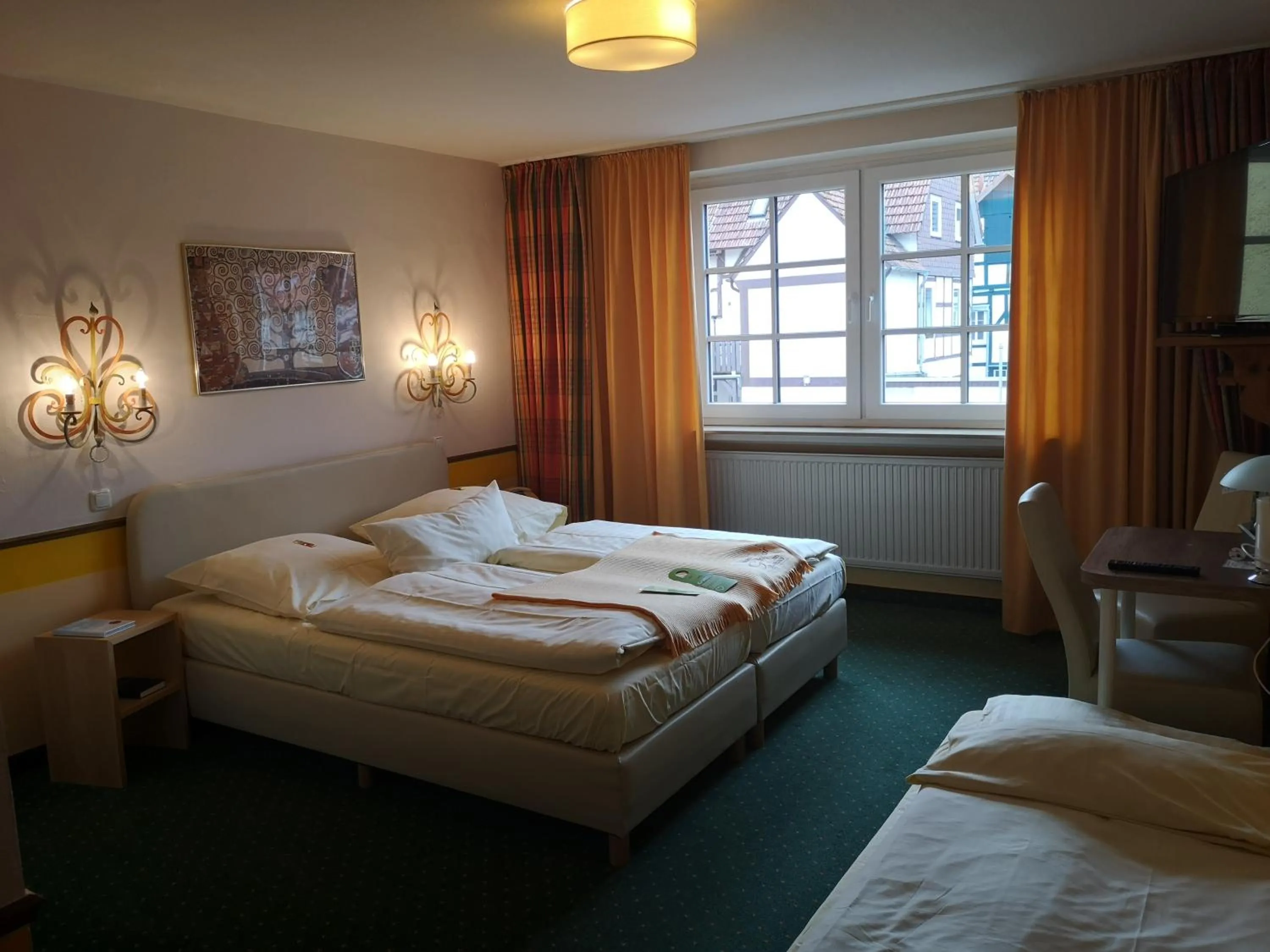 Photo of the whole room, Bed in Hotel Goldflair am Rathaus