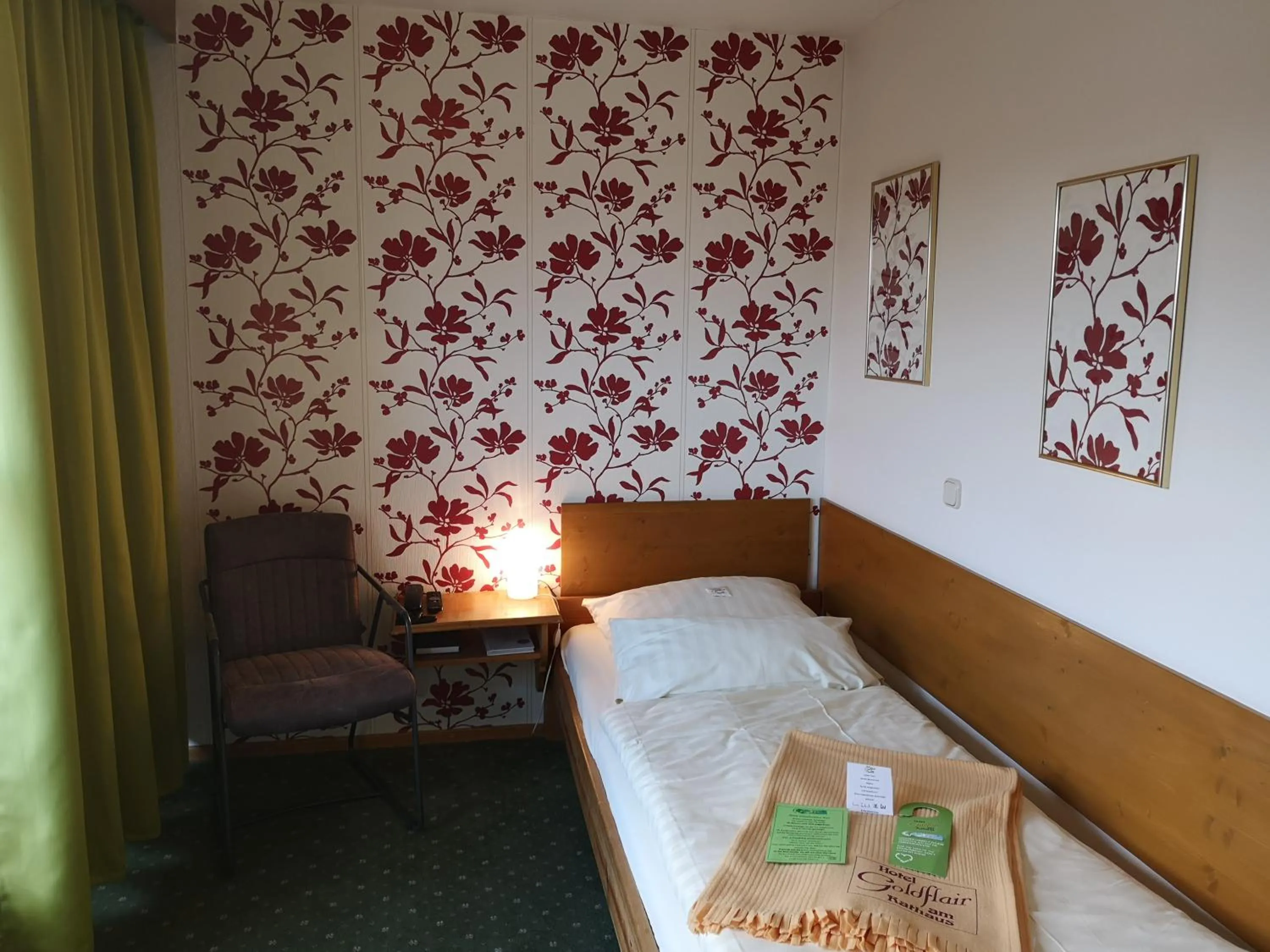 Photo of the whole room, Bed in Hotel Goldflair am Rathaus