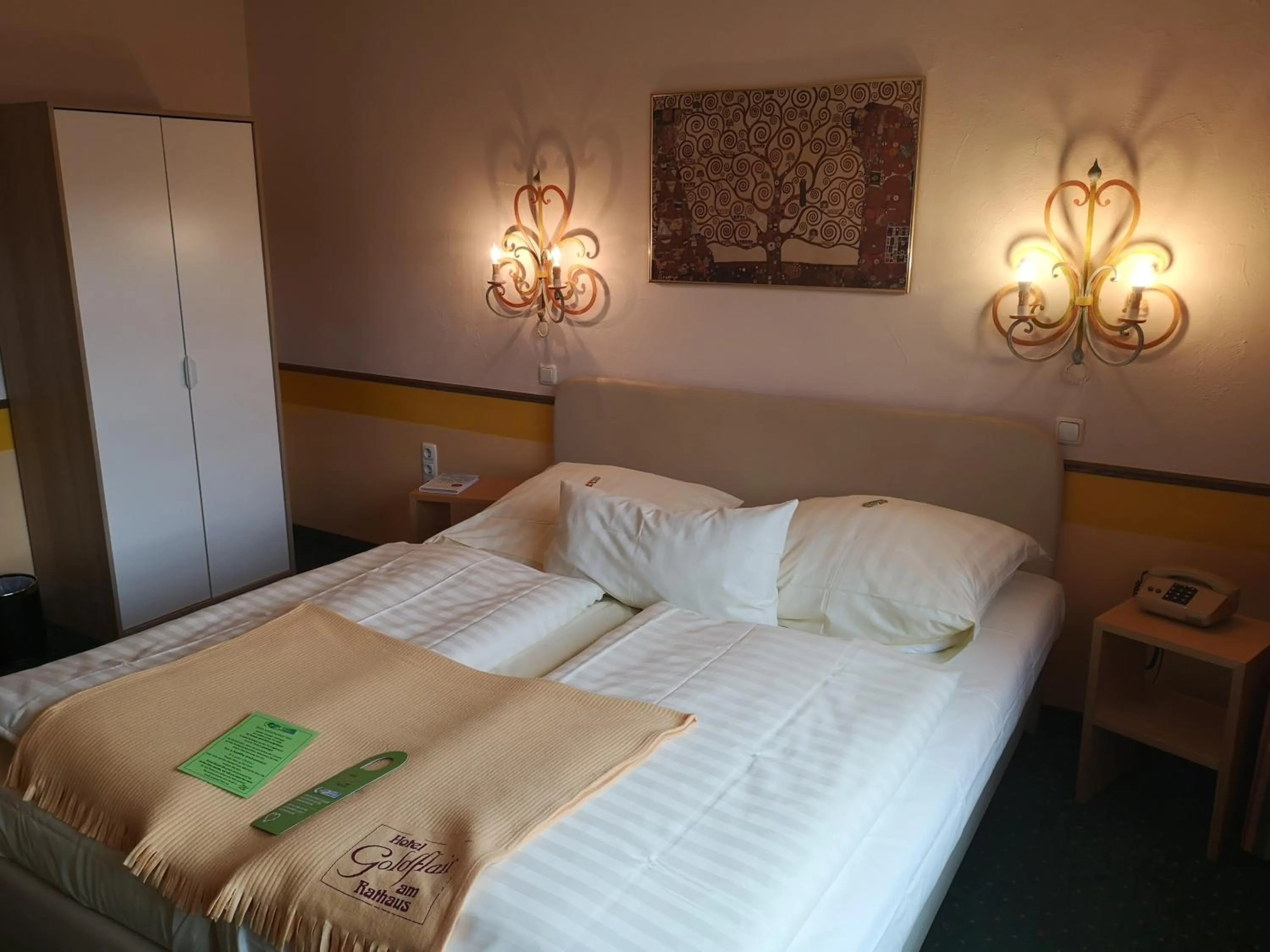 Photo of the whole room, Bed in Hotel Goldflair am Rathaus
