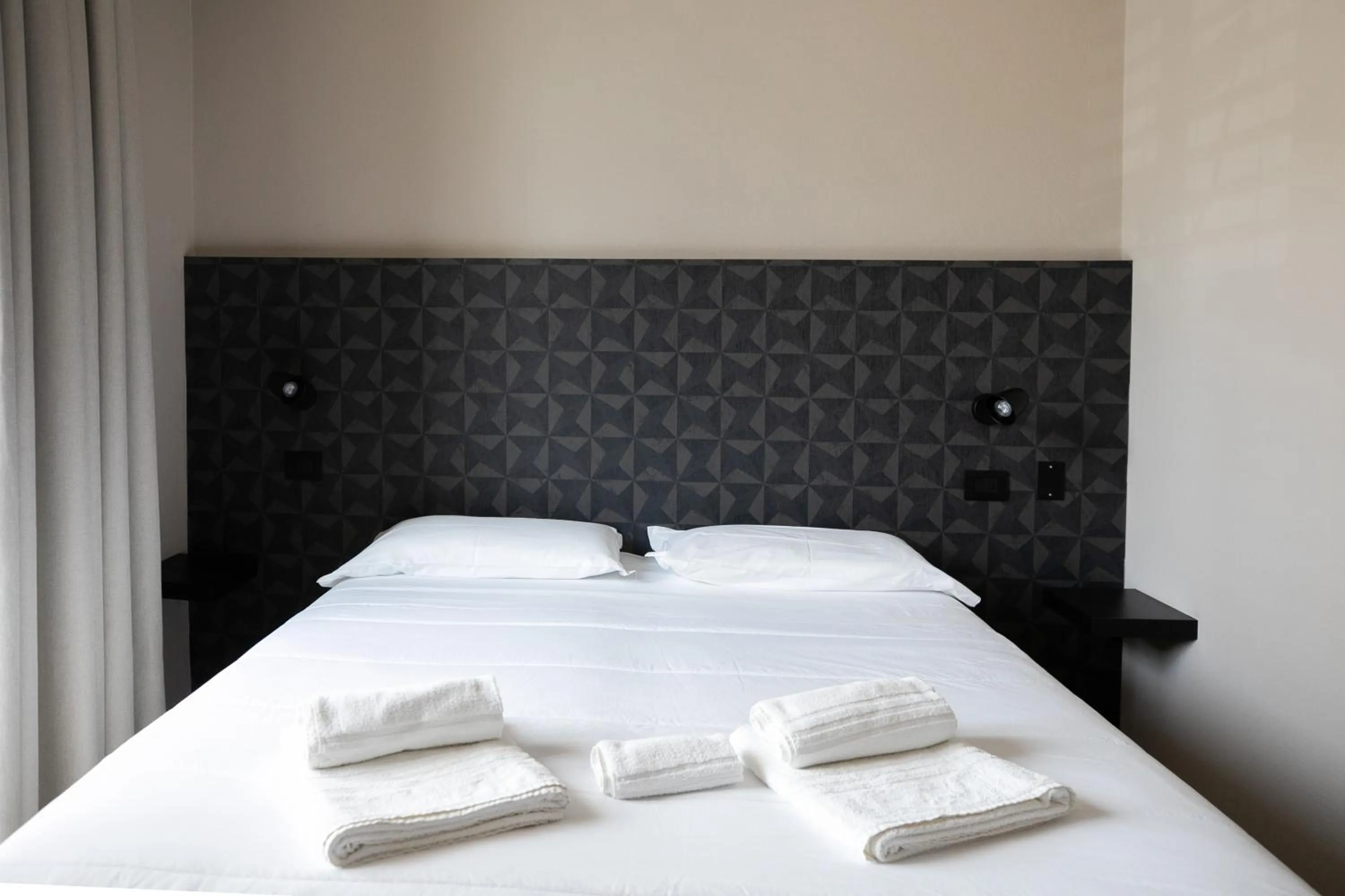 Bed in Hotel Benvenuto