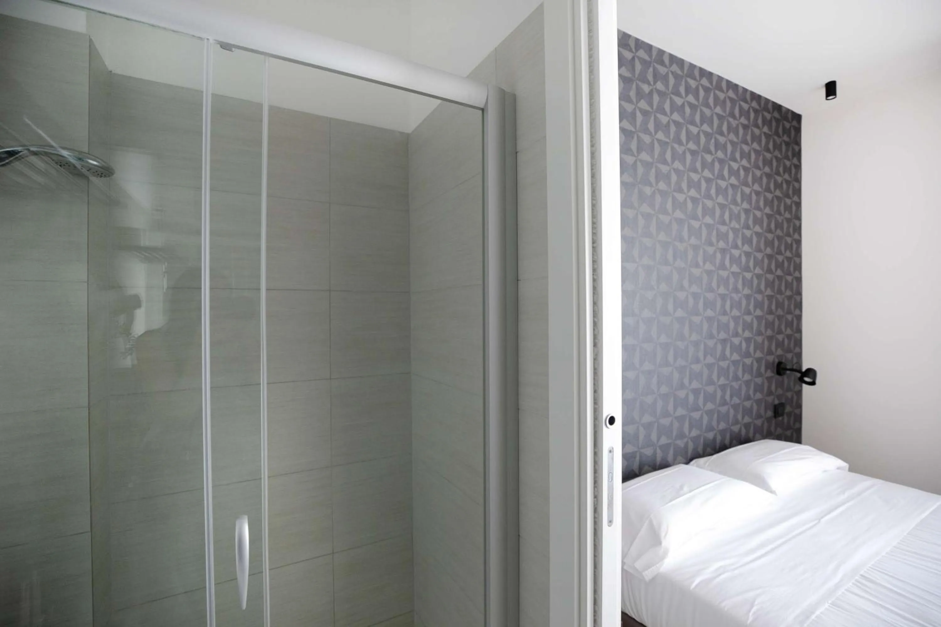 Bed in Hotel Benvenuto