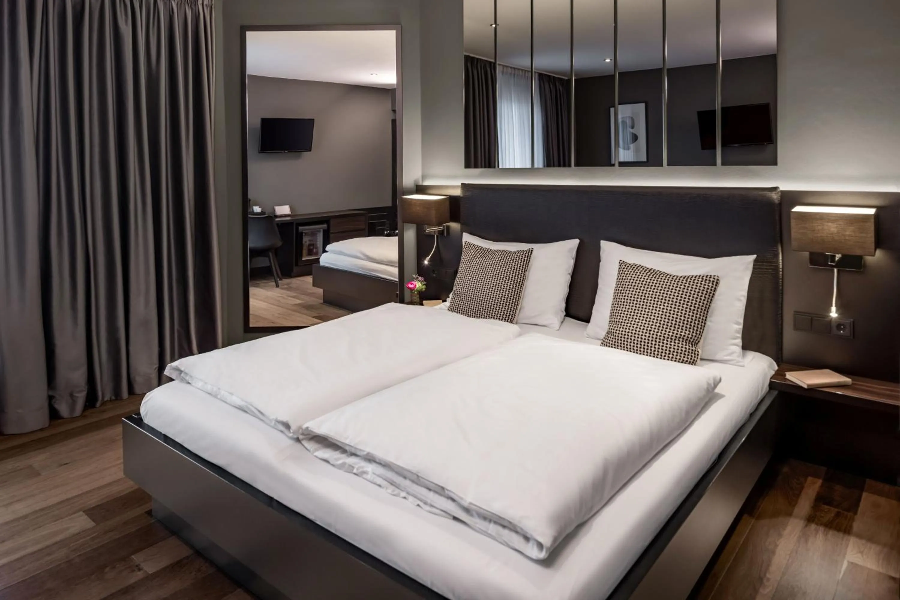 Bed in Hotel AMANO Düsseldorf