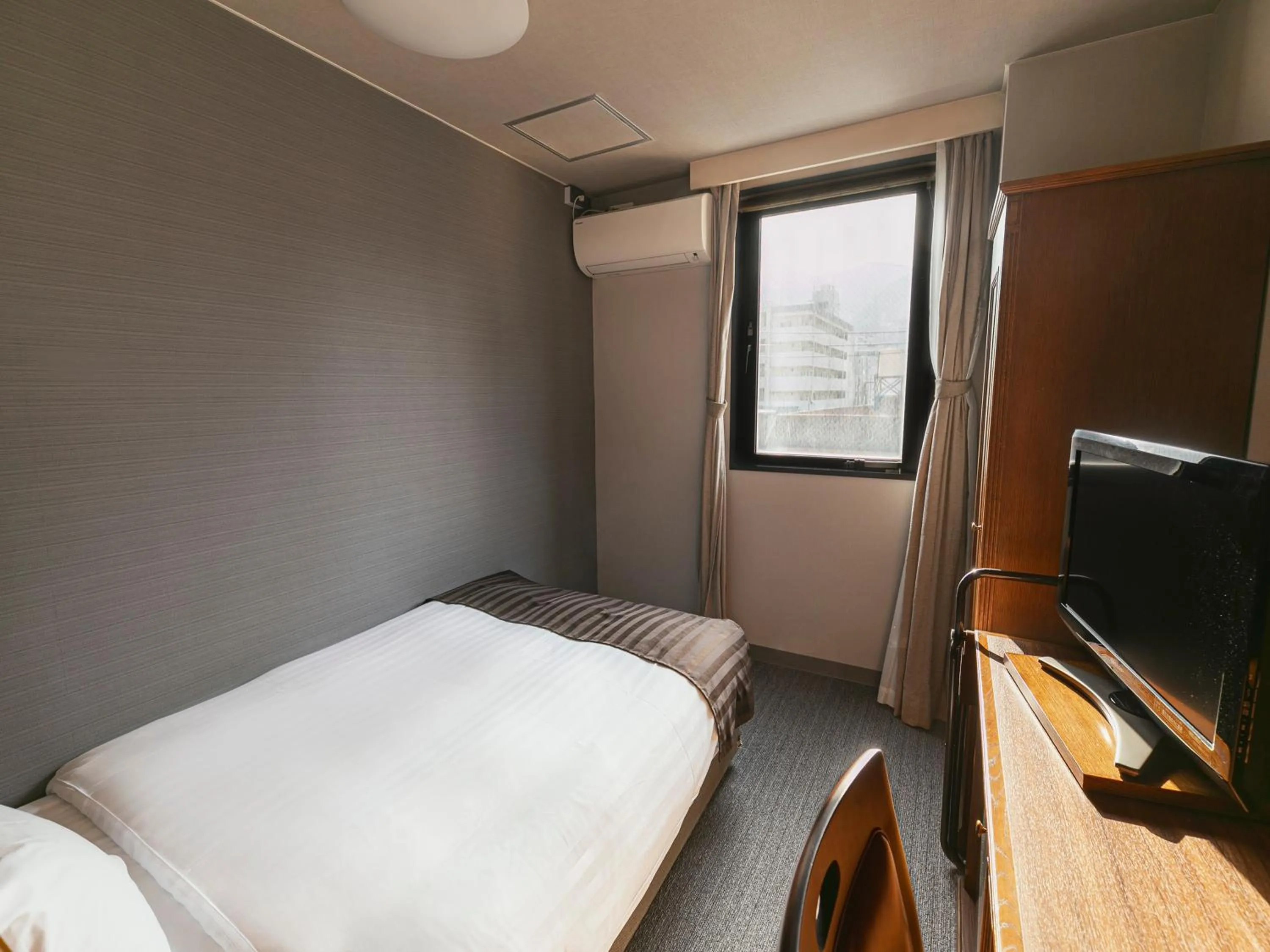 Bed in Hotel Arthur KITAHAMA BASE