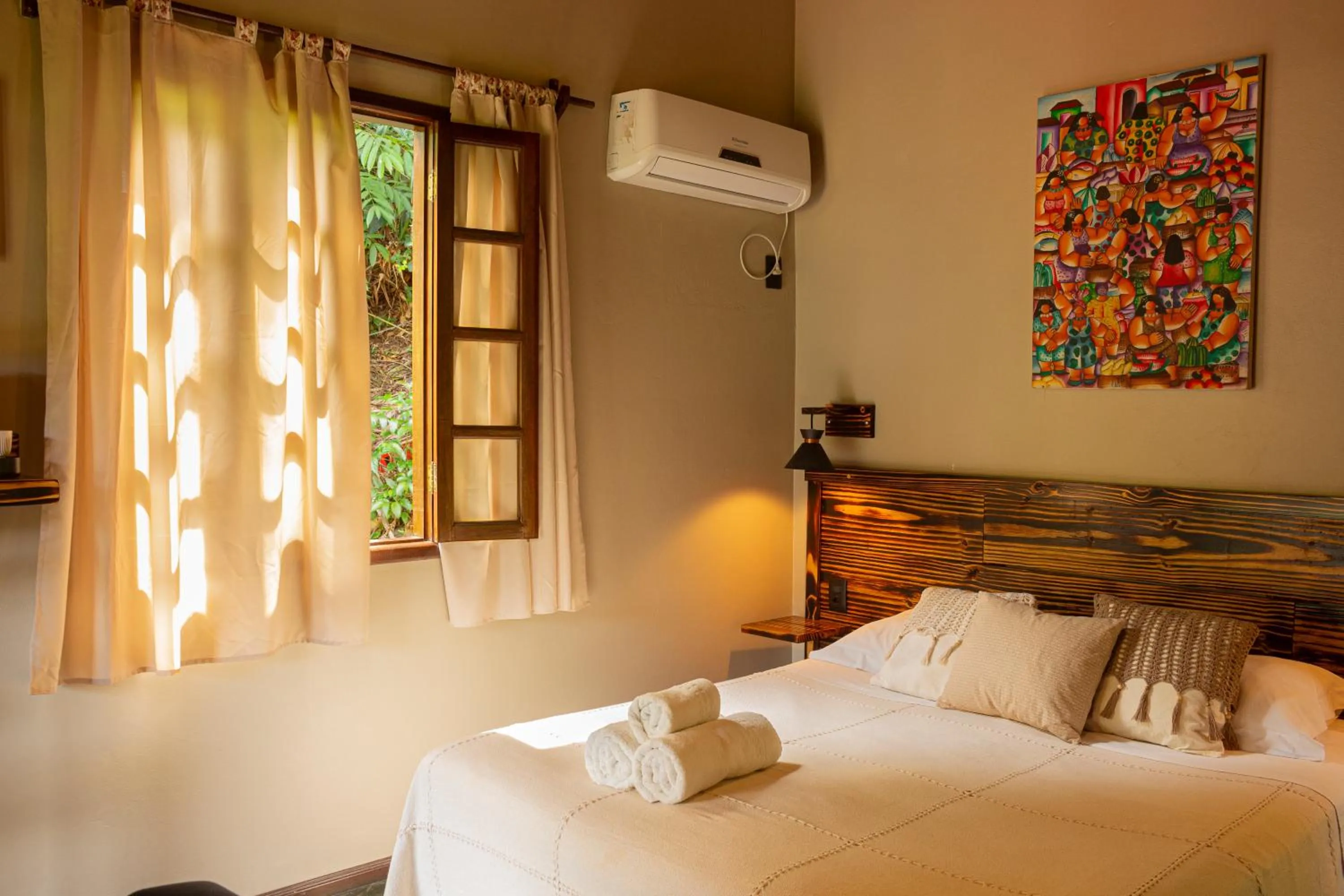 Bed in Pousada Aquarela