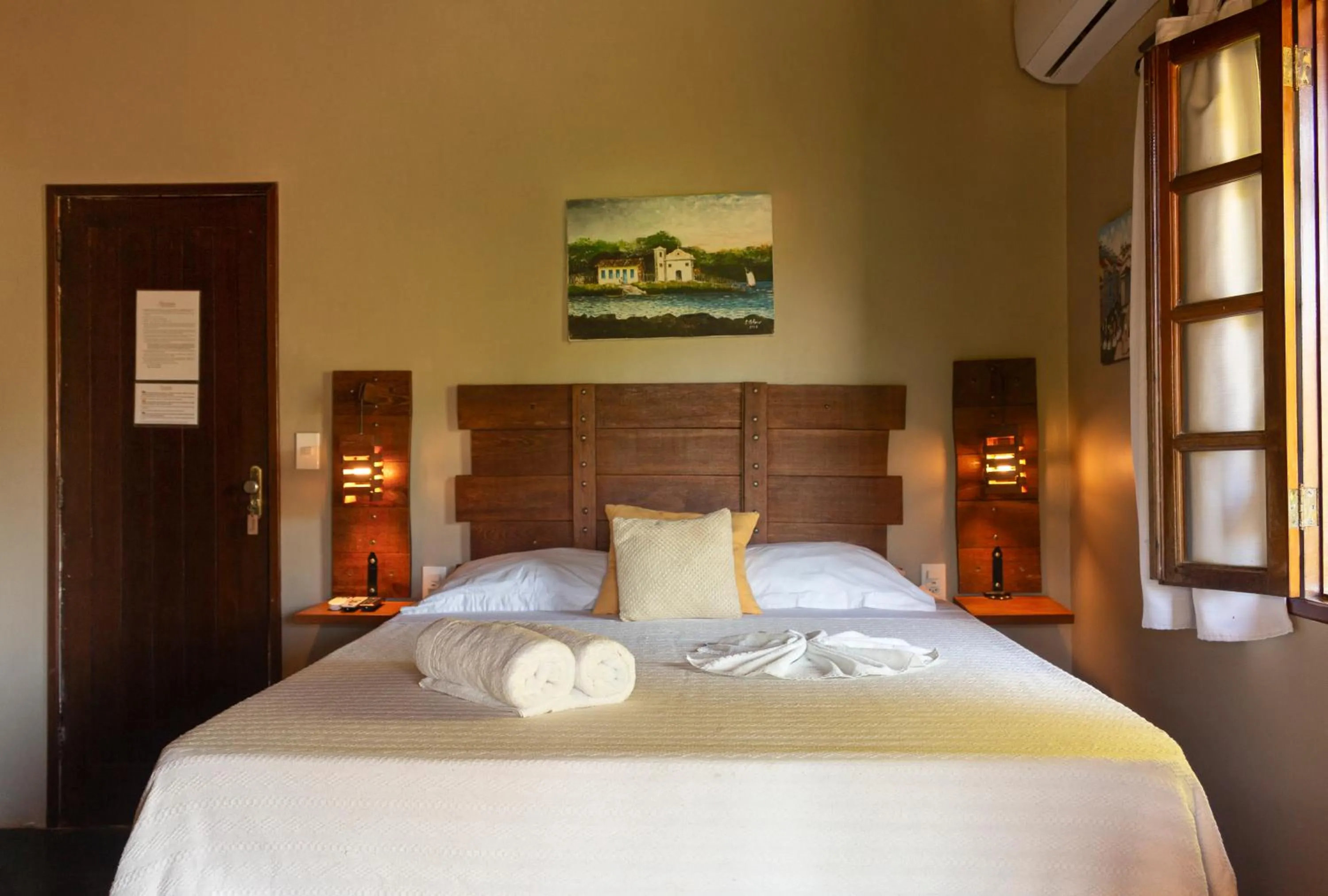 Bed in Pousada Aquarela