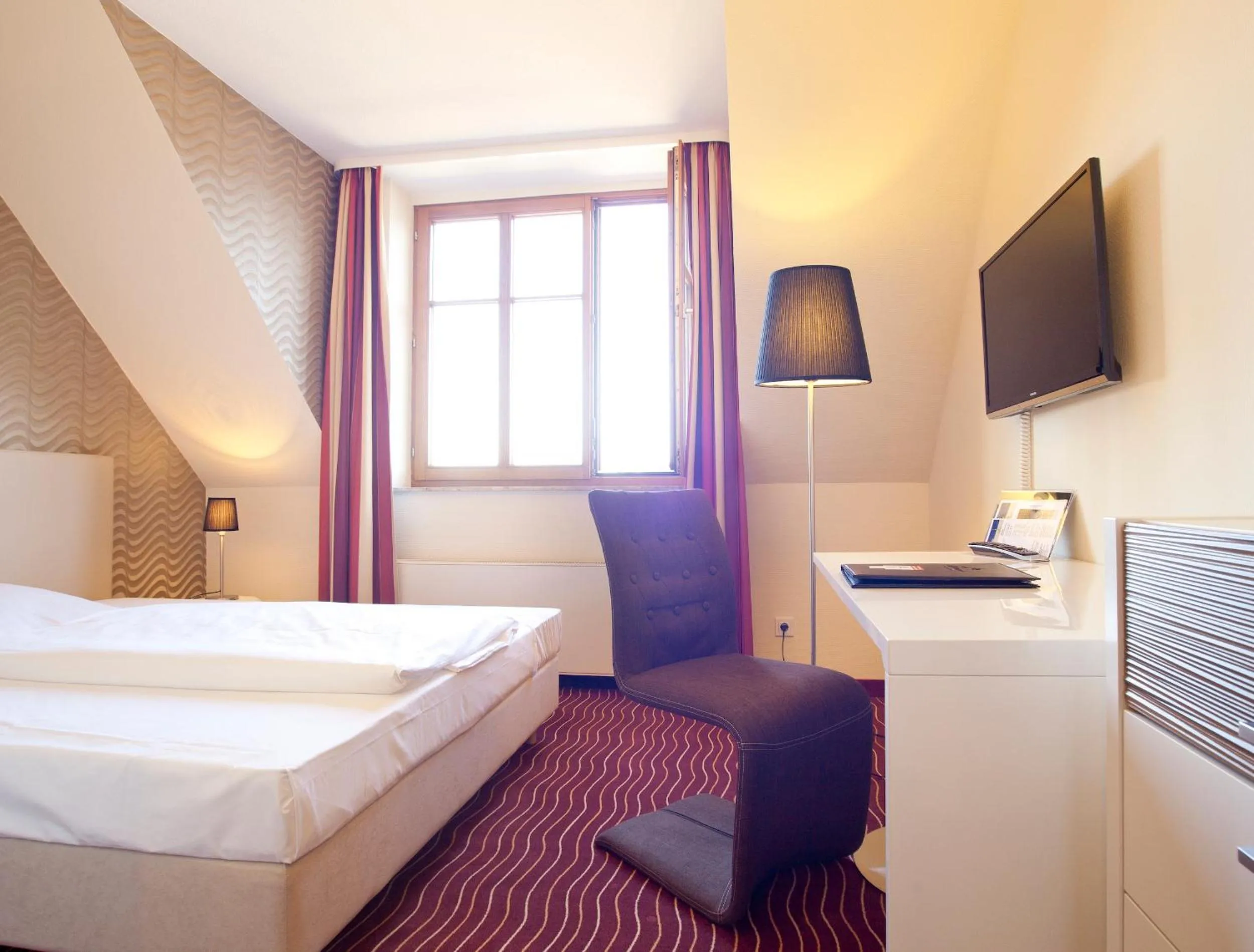 Photo of the whole room, Bed in HKK Hotel Wernigerode