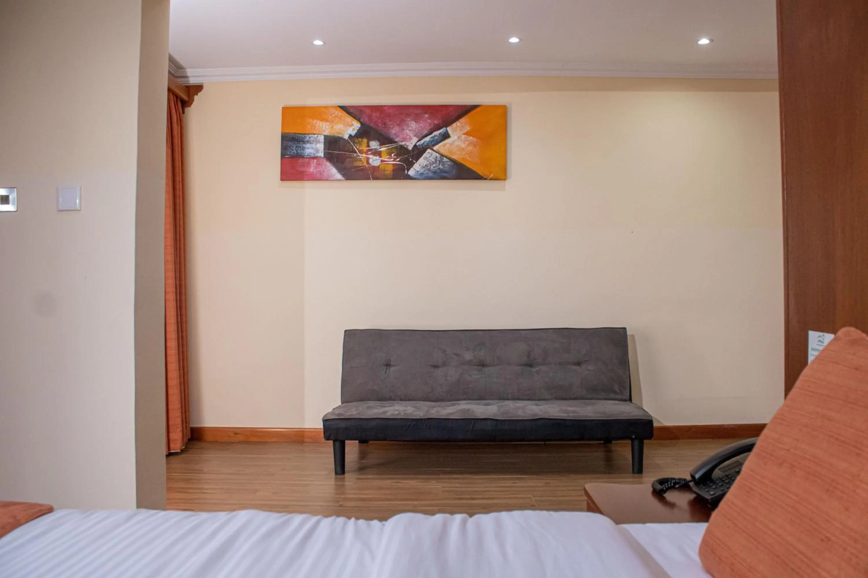 Seating area, Bed in Lake Elementaita Mountain Lodge