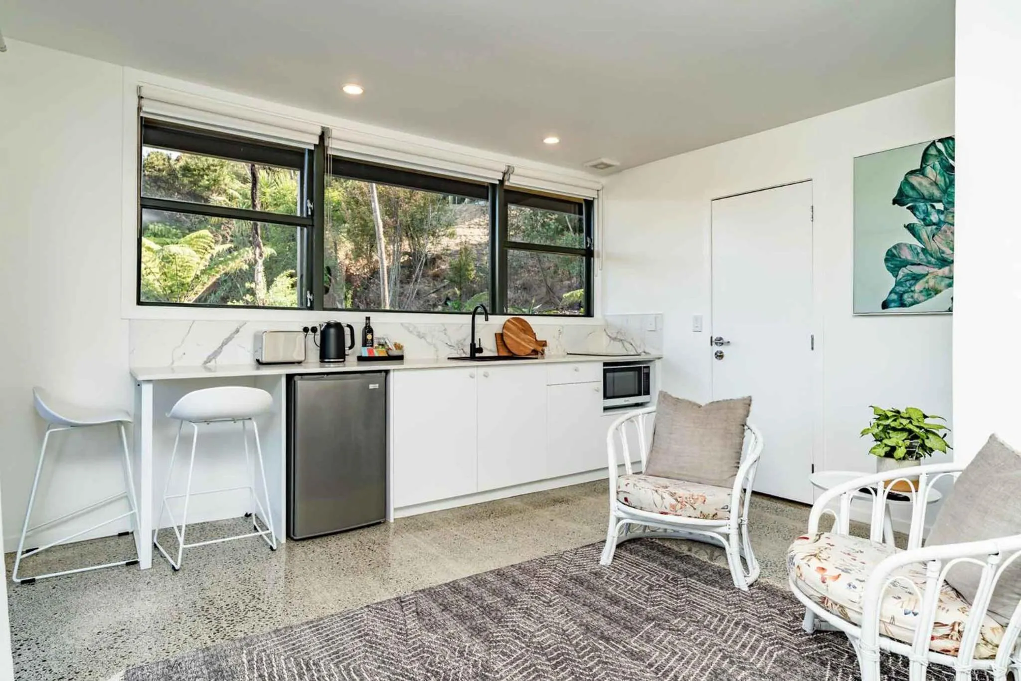 Kitchen or kitchenette in Tui & Nikau Cabins