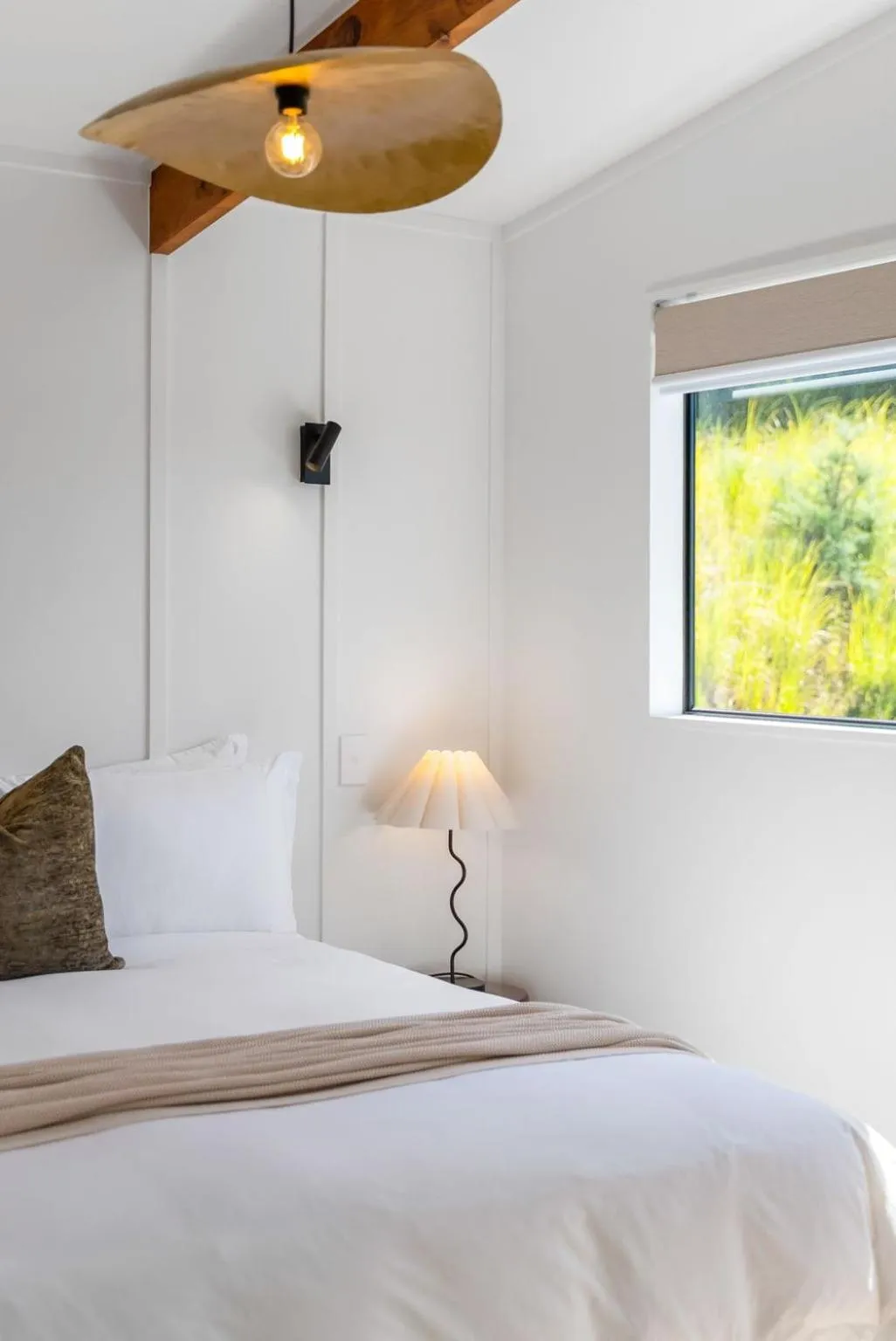 Bed in Tui & Nikau Cabins