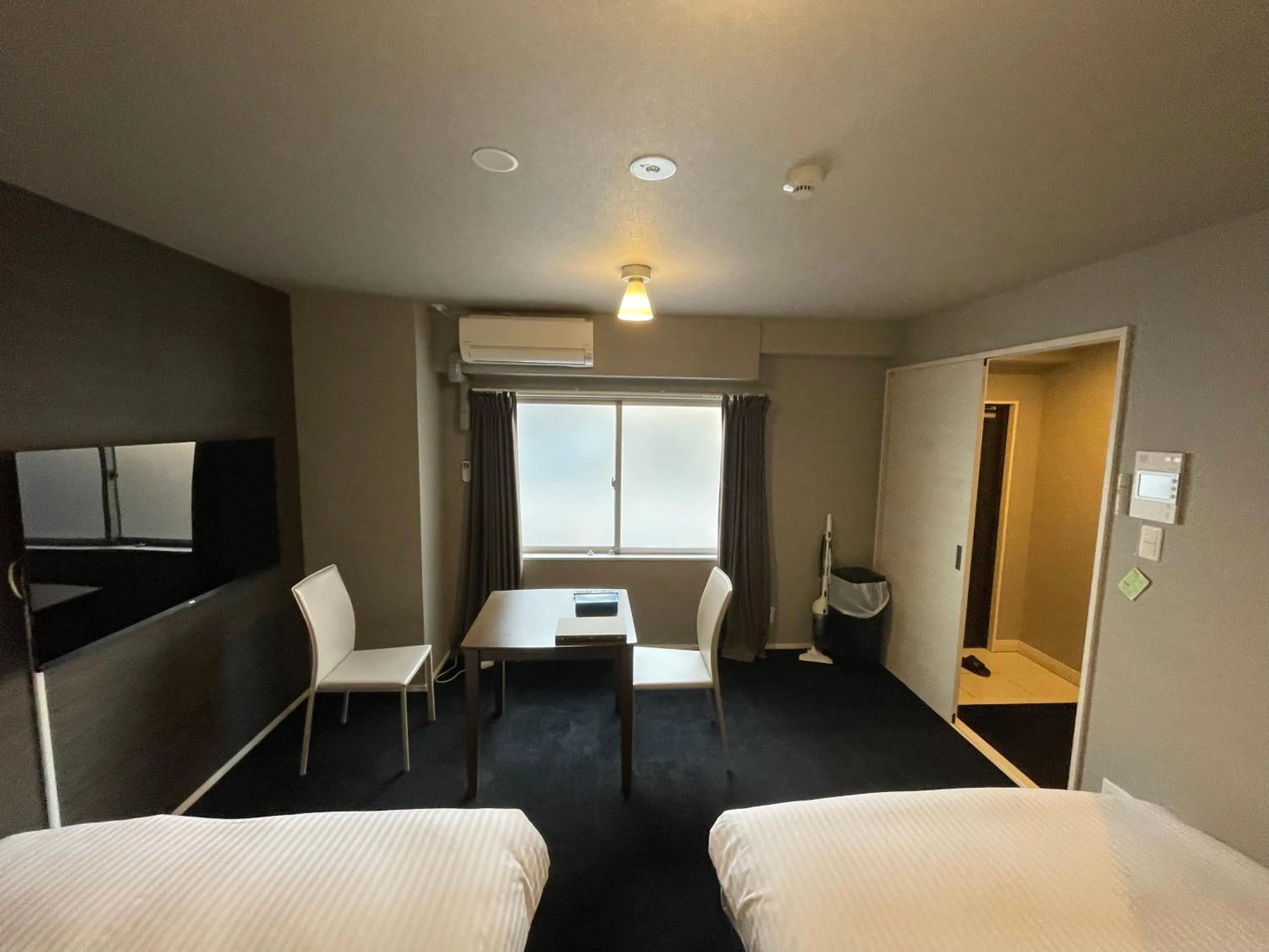 Bed in The Grand Residence Hotel Tenjin