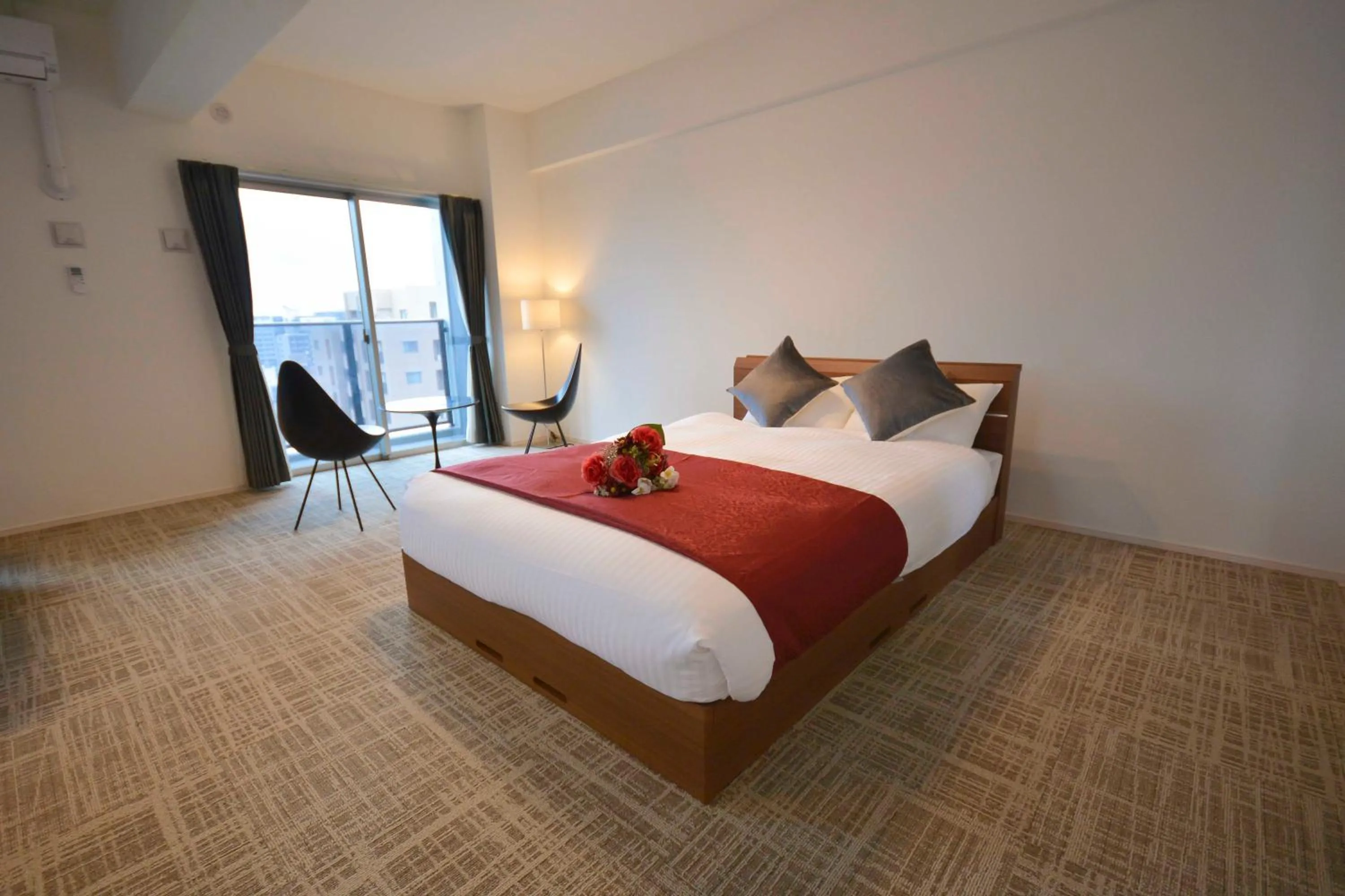 Bed in The Grand Residence Hotel Tenjin